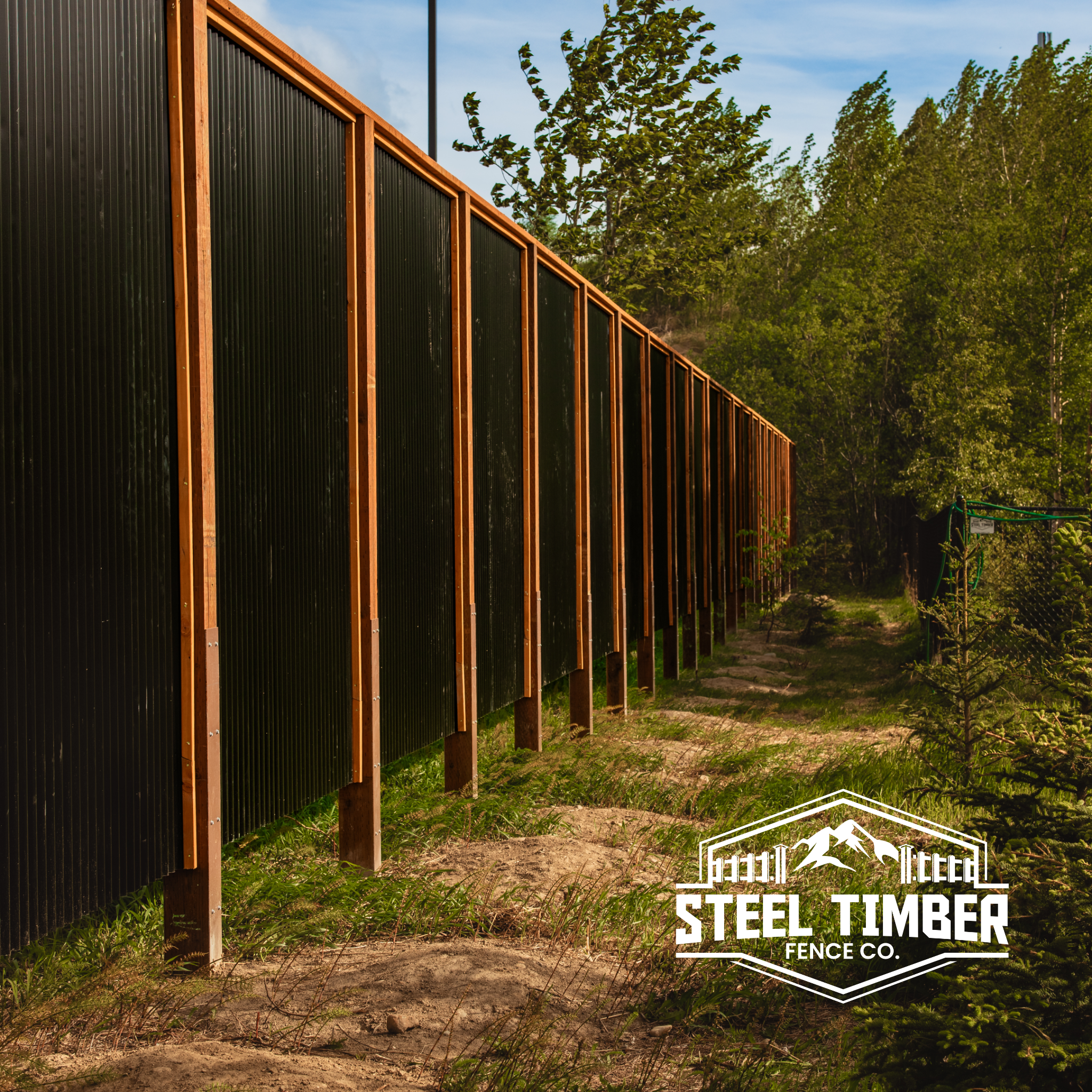 Black steel and timber cedar framed fence with Steel Timber Fence Co. logo