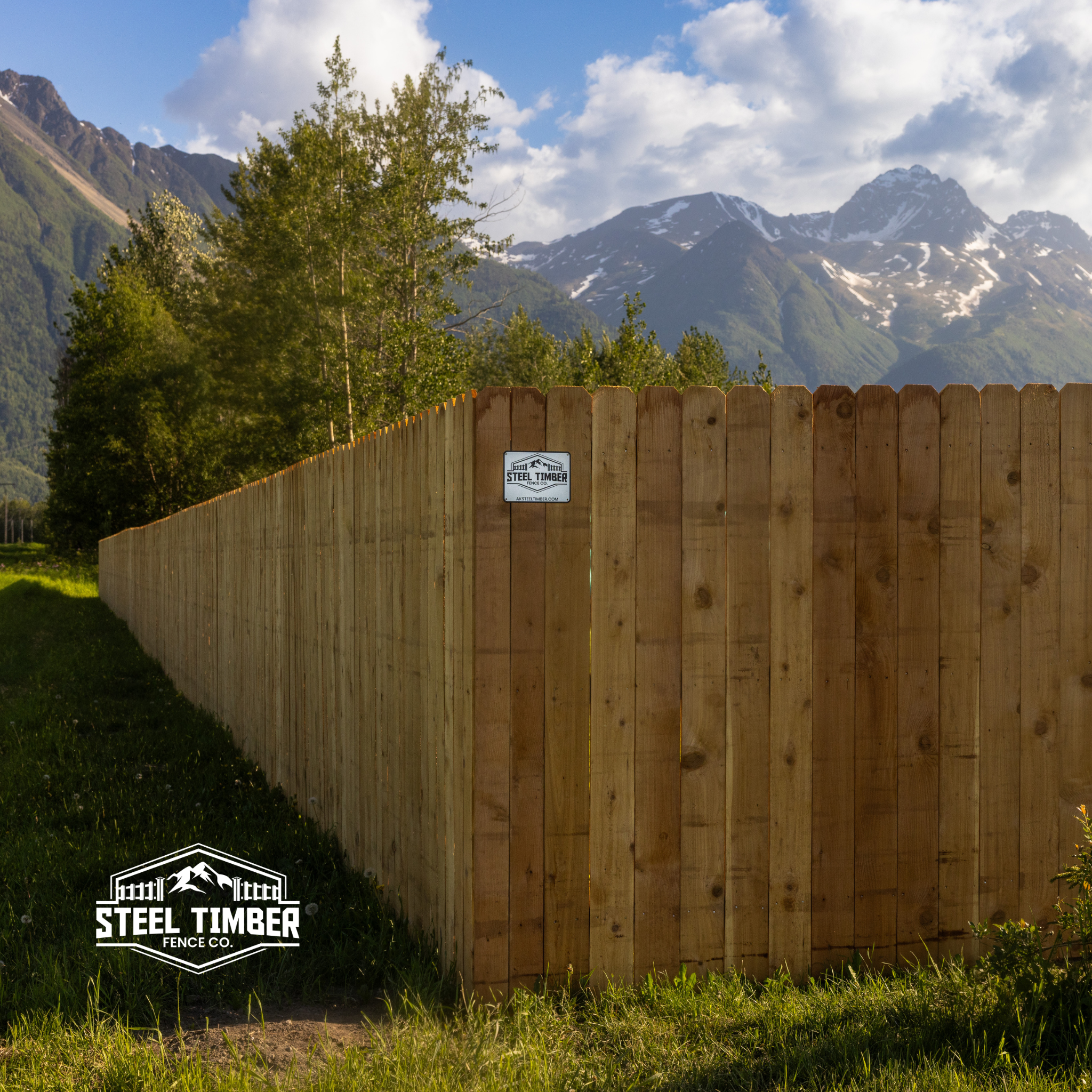 Western Red Cedar fence by Steel Timber Fence Co. with Alaskan mountains in the background