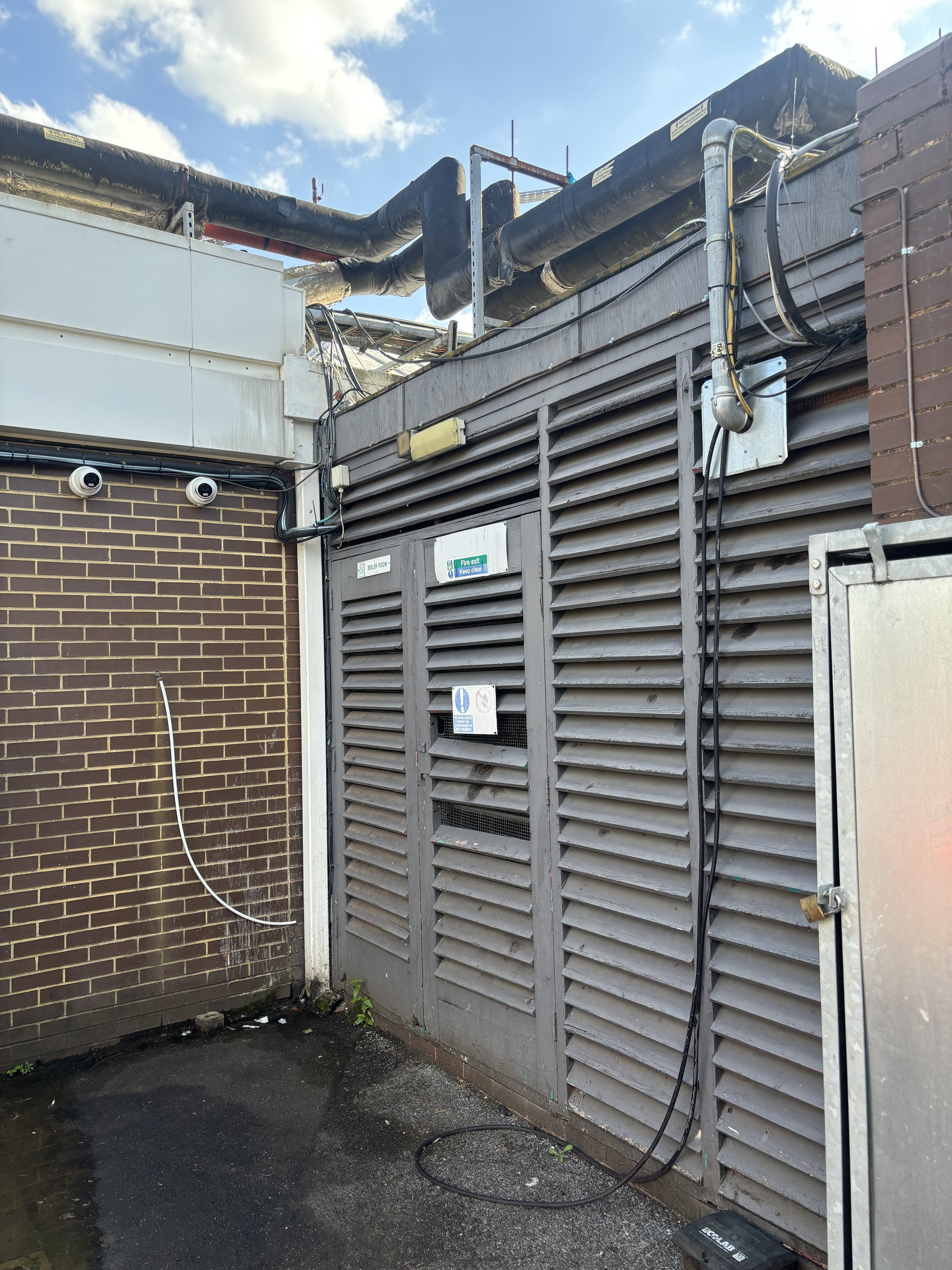 A CLASSIC (OLDER FORMAT) OR AN AQUAMATION FACILITY WITH PIPES, ELECTRICS AND LIQUIFYING AREA. SITUATED AROUND THE BACK OF THE SERVICE STATION