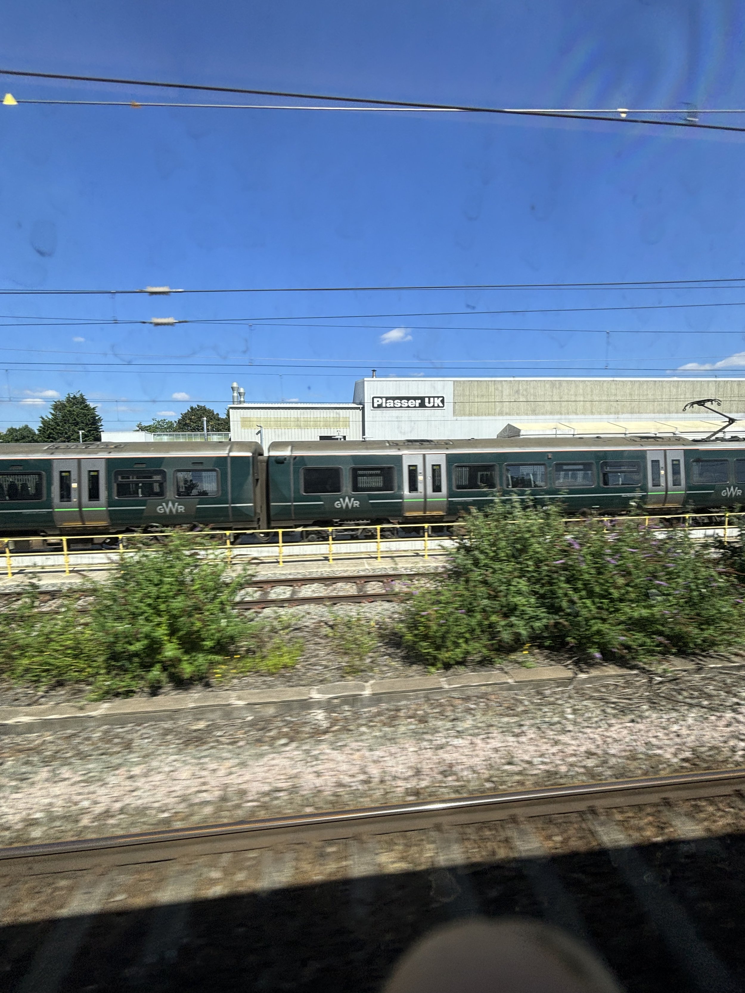 SLOUGH/WINDSOR. ANIOTHER SONEWHAT GENERIC BUILDING AND ONCE AGAIN THE VIEW BEING BLOCKED BY ROLLING STOCK