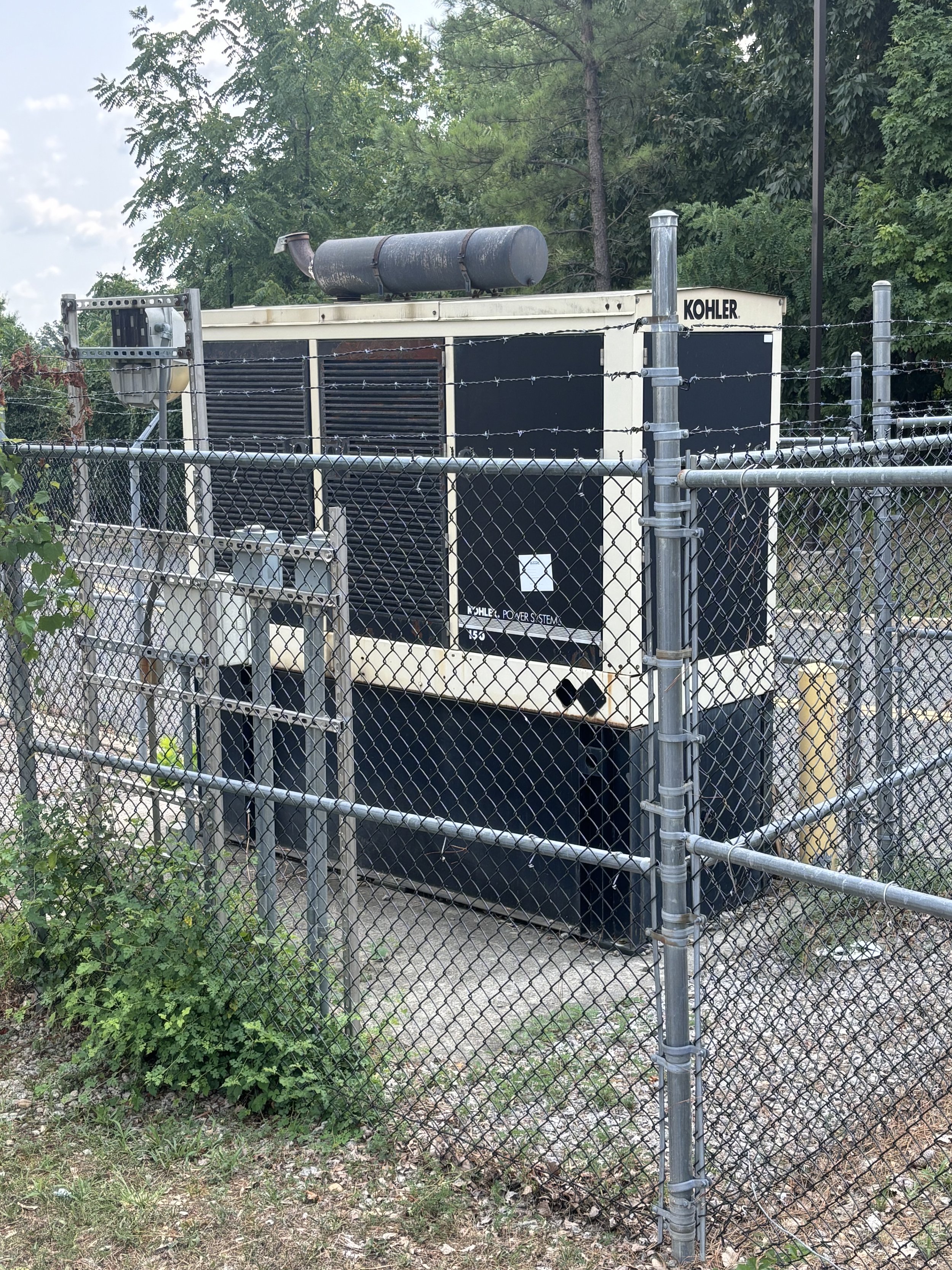 A POWER STATION OUTSIDE THE BACK ENTRANCE. WHAT IS IT DOING THERE?
