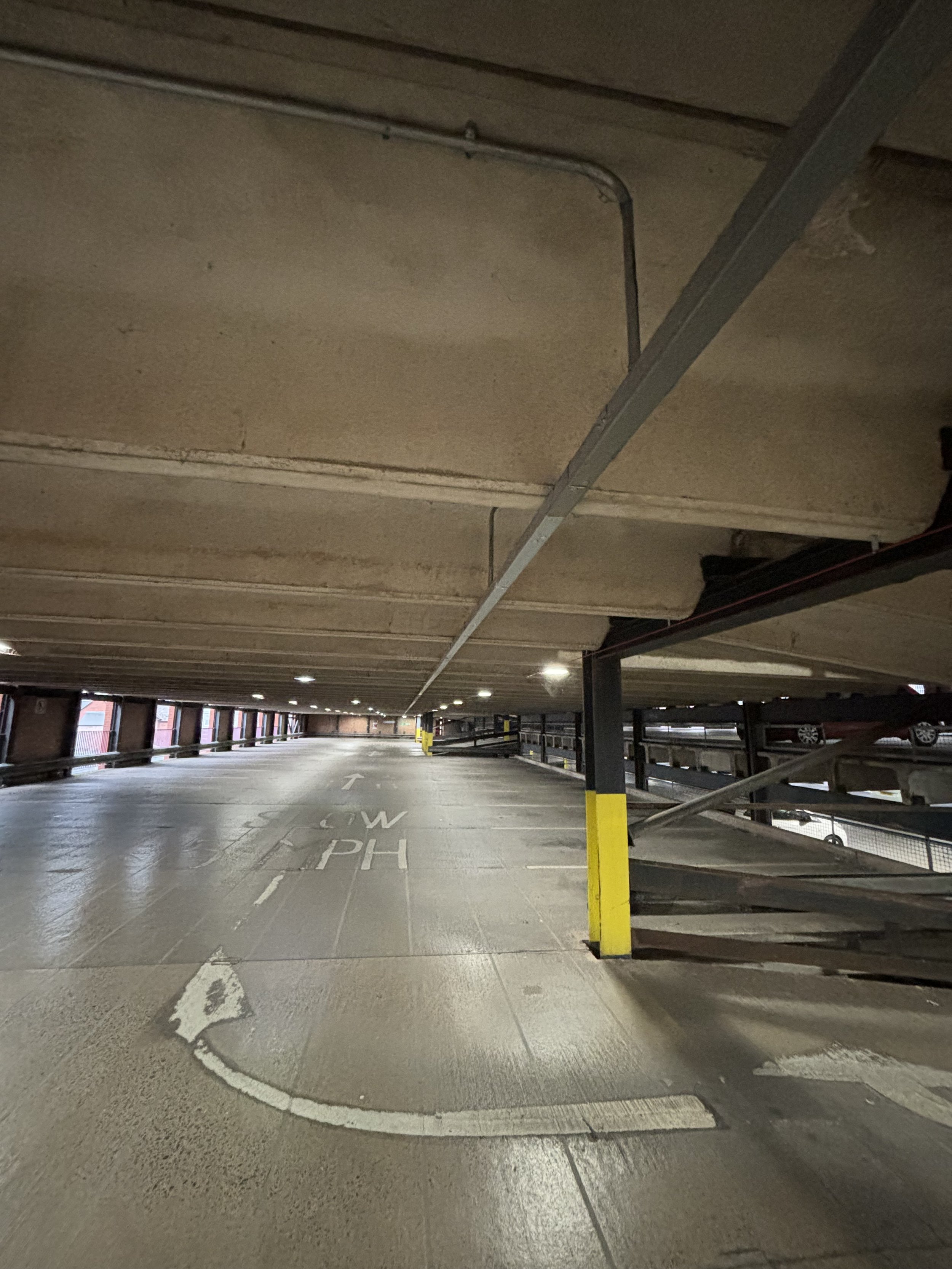 PIPES WHICH RUN THE ENTIRE LENGTH OF THE CAR PARK AND THESE ARE FED FROM THE FLOOR ABOVE