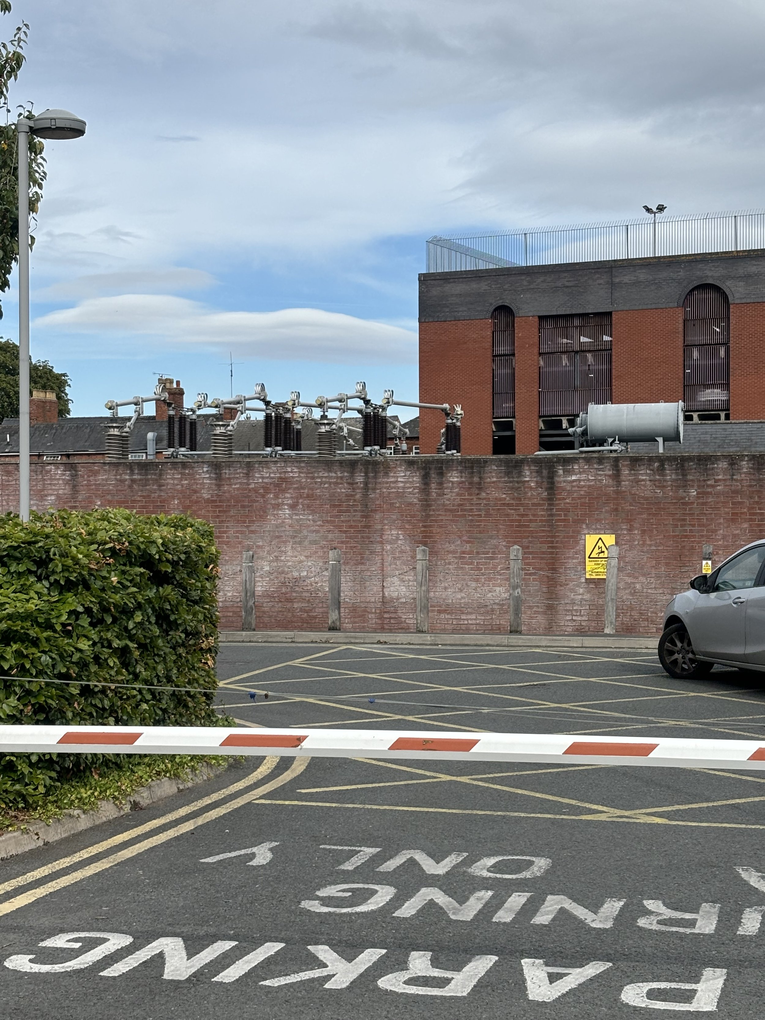 AT THE BACK OF WAGAMAMAS I S A HUGE ELECTRICITY STATION WITH LARGE TUBES ON TOP AND A CLASSIC FORMAT FOR HIGH VOLTAGE AQUAMATION
