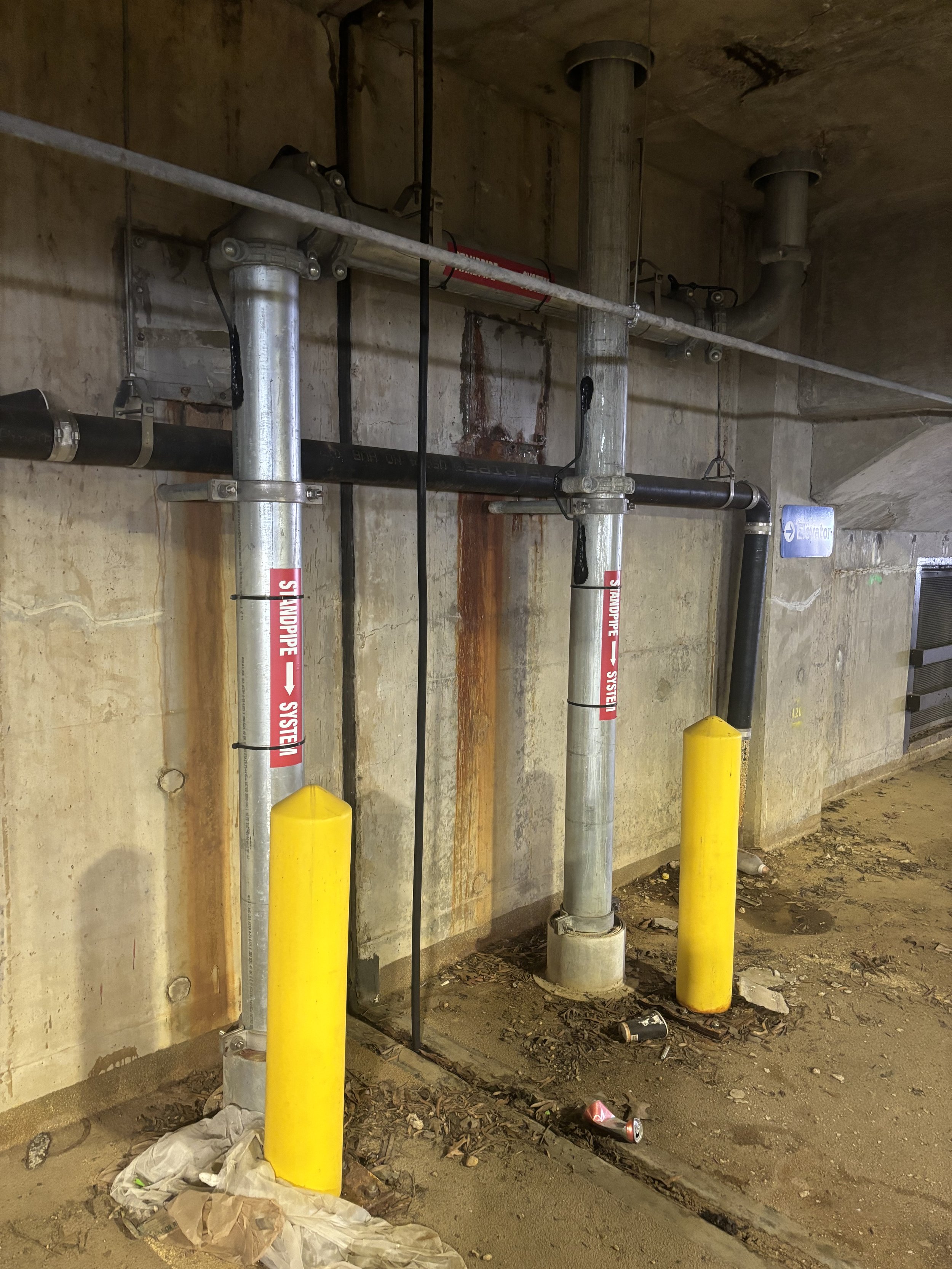 LARGER PIPING FROM OLD CAR PARK AND MARKED AS 'STANDPIPE SYSTEM'