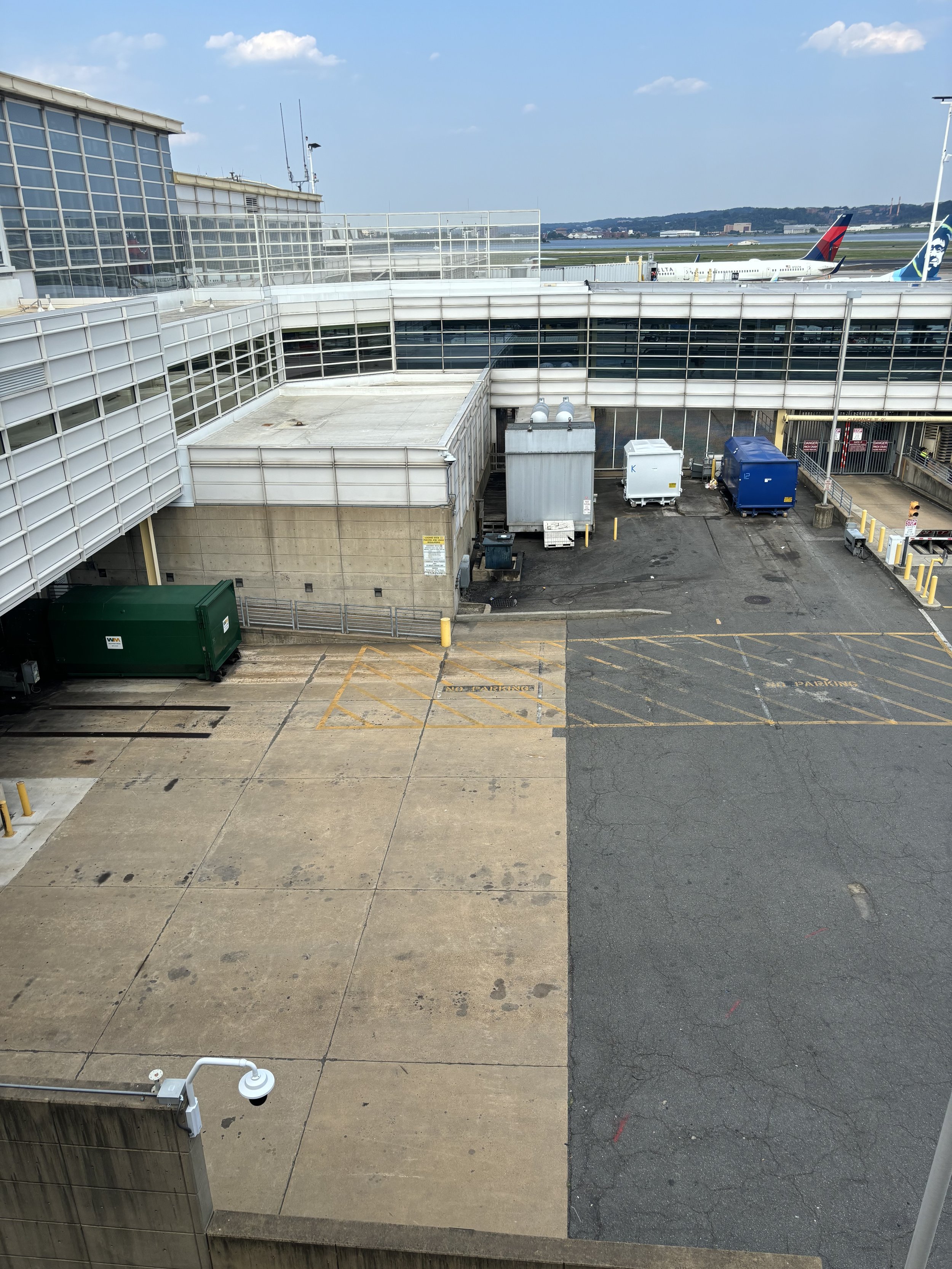 JUST TO THE RIGHT OF THE MAIN BUILDING - THERE’S THREE CONTAINERS DIRECTLY IN FRONT. THE LEFT CONTAINER HAS PIPES WHICH LOOK LIKE PUMPS FOR THE AQUAMATION PROCESS.
