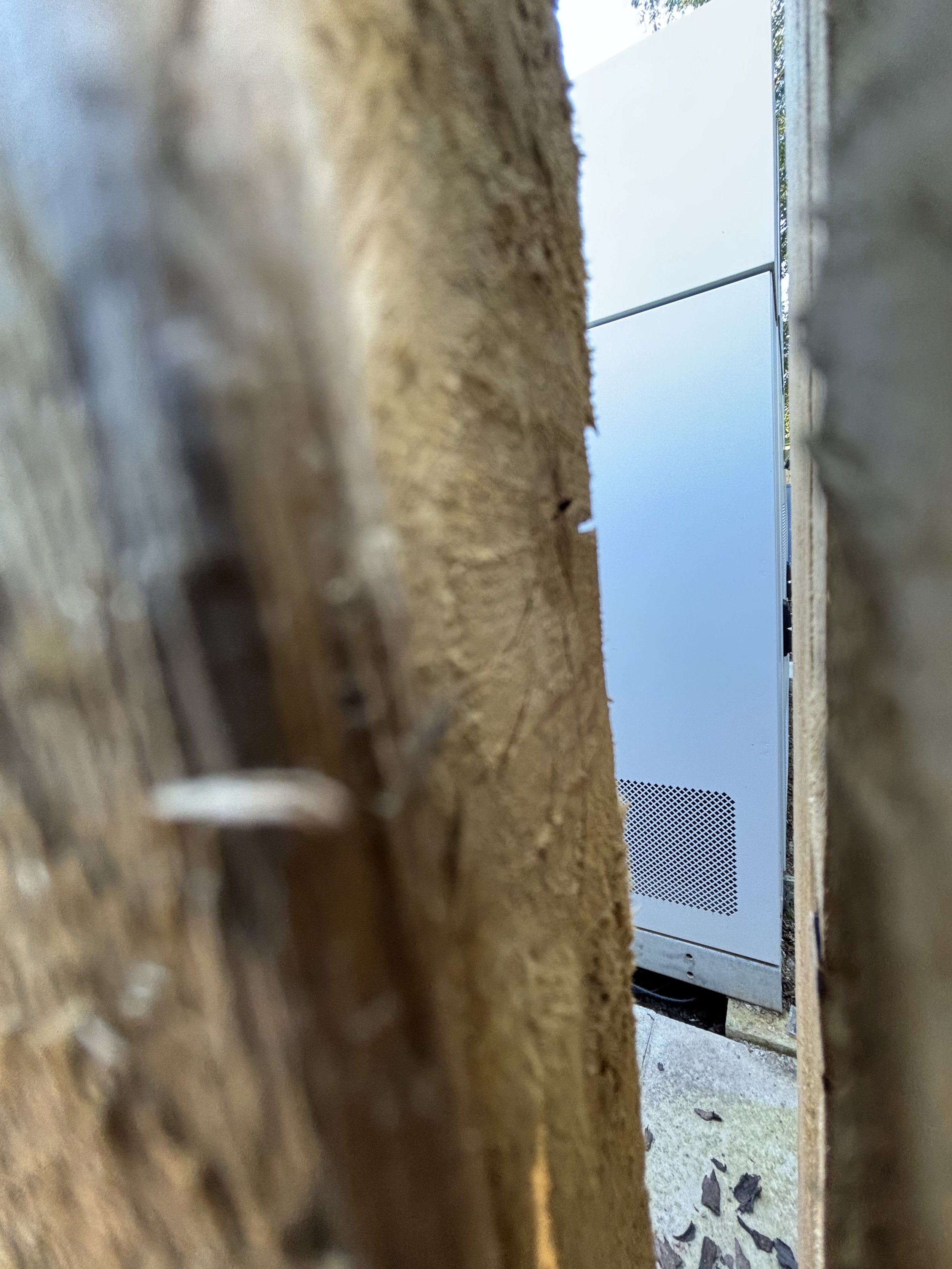 NEXT TO THE GREEN ELECTRICS, THERE IS A WOODEN PERIMETER WHICH IS TIGHTLY ENCLOSED. A SMALL GAP ENABLED A PHOTO TO BE TAKEN AND IT REVEALS A SEEMINGLY NEW AND EXPENSIVE ARRAY OF HIGH TECHNOLOGY APPARATUS. A QUICK ANALYSIS INTO WHAT THE EQUIPMENT PERF