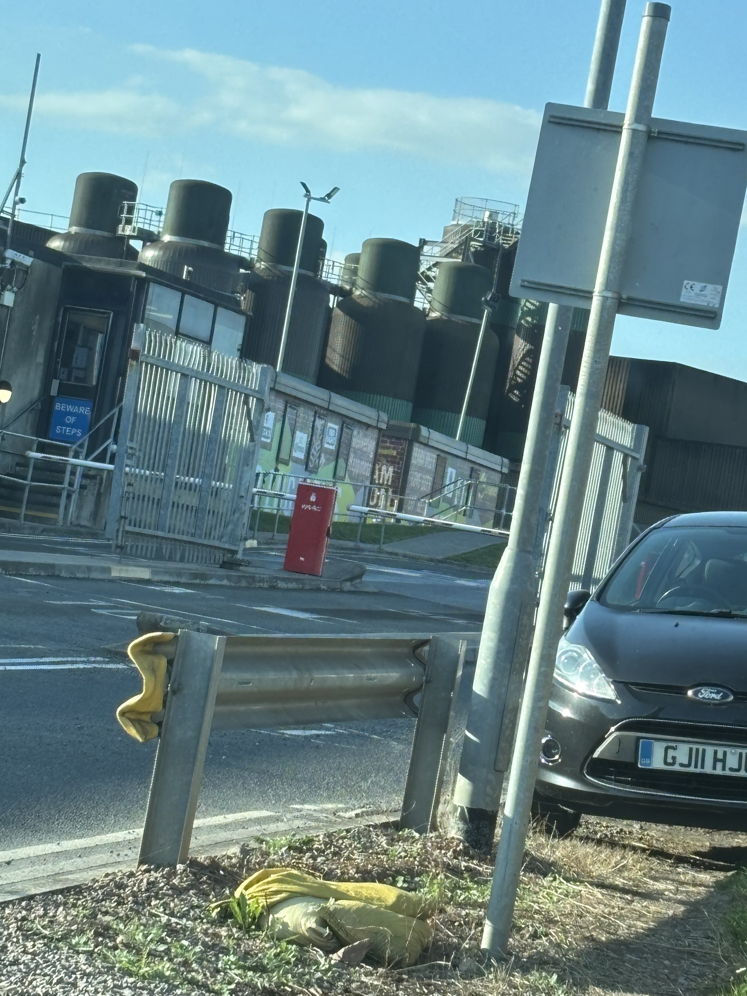 A HUGE ARRAY OF CHIMNEYS VISIBLE AND VERY HIGH SECURITY IN THIS 'BREWERY' JUST OFF MAGOR SERVICES ON THE M4