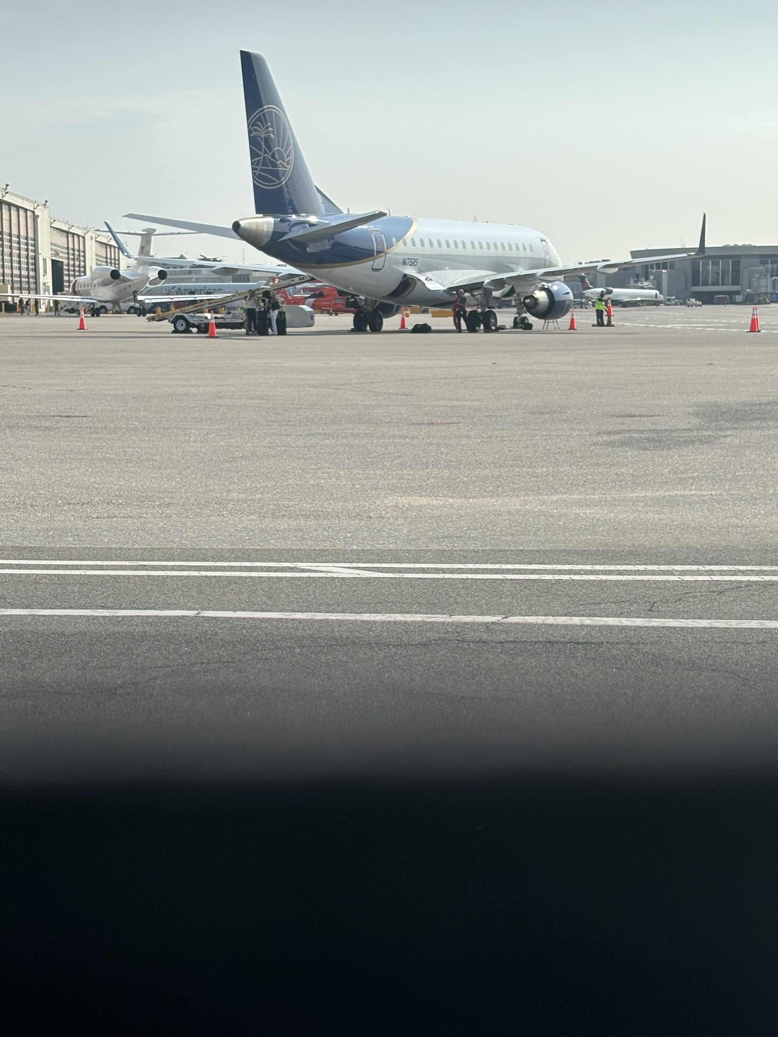 A WING ON A PLAN IS INSPECTED SINCE THERE MIGHT BE A TECHNICAL PROBLEM EMERGING FROM THE AQUAMATION LIQUID SPILLING INTO ENGINES. IF SO THEN ENTIRE FLEETS OF PLANED WILL BE GROUNDED FOR INSPECTION