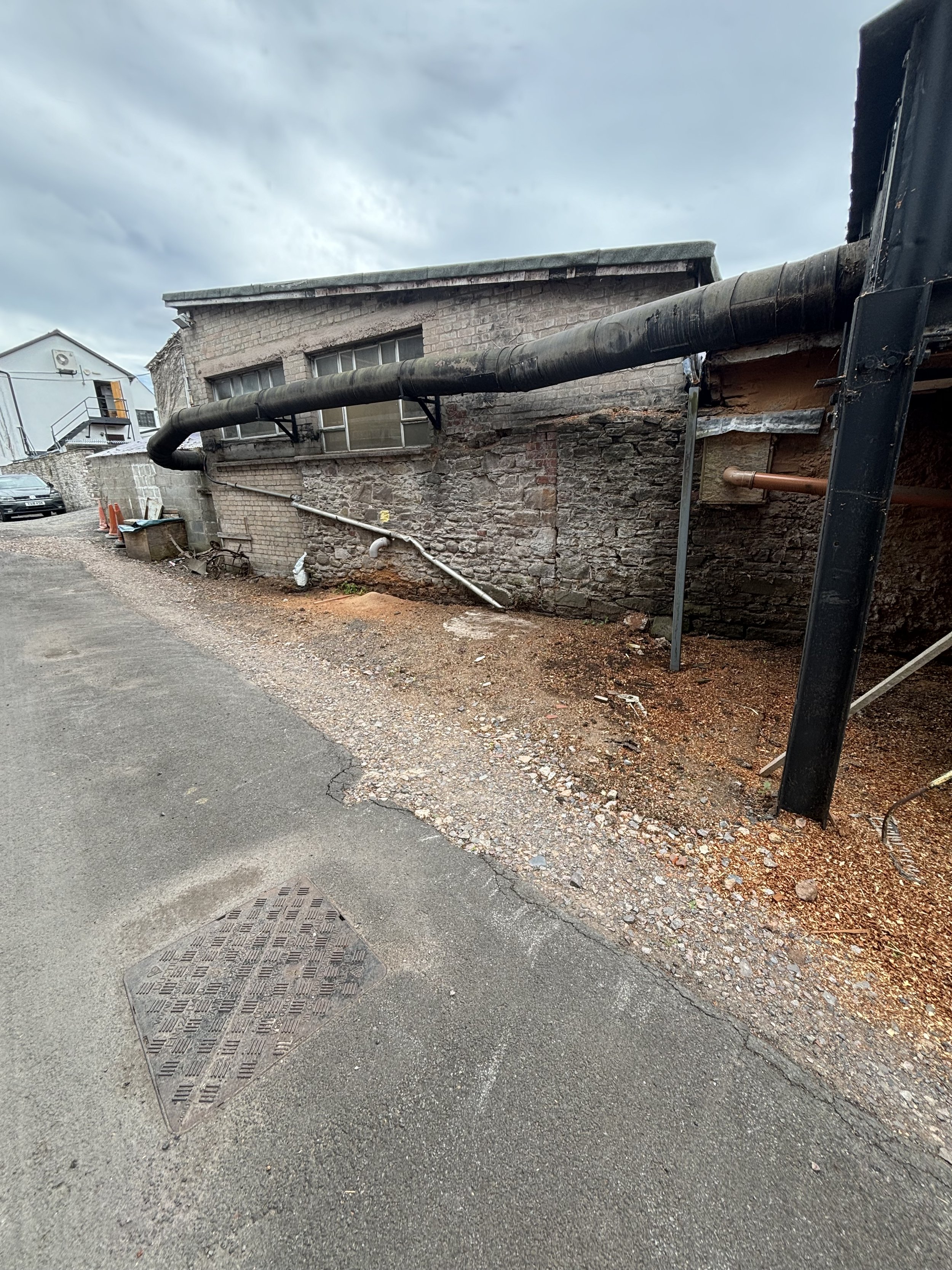 A COMPANY TRADING AS A WOOD MILL HAS SOME VERY DARK EQUIPMENT AND A HIDDEN AQUAMATION FACILITY. A HUGE CHIMEY AND BLACK PIPE LEADING FROM AN OUT HOUSE. A WOOD SMELL FROM THE CHIPPINGS BUT THIS COULD BE MANUALLY THROWN DOWN EACH MORNING TO MAKE PEOPLE
