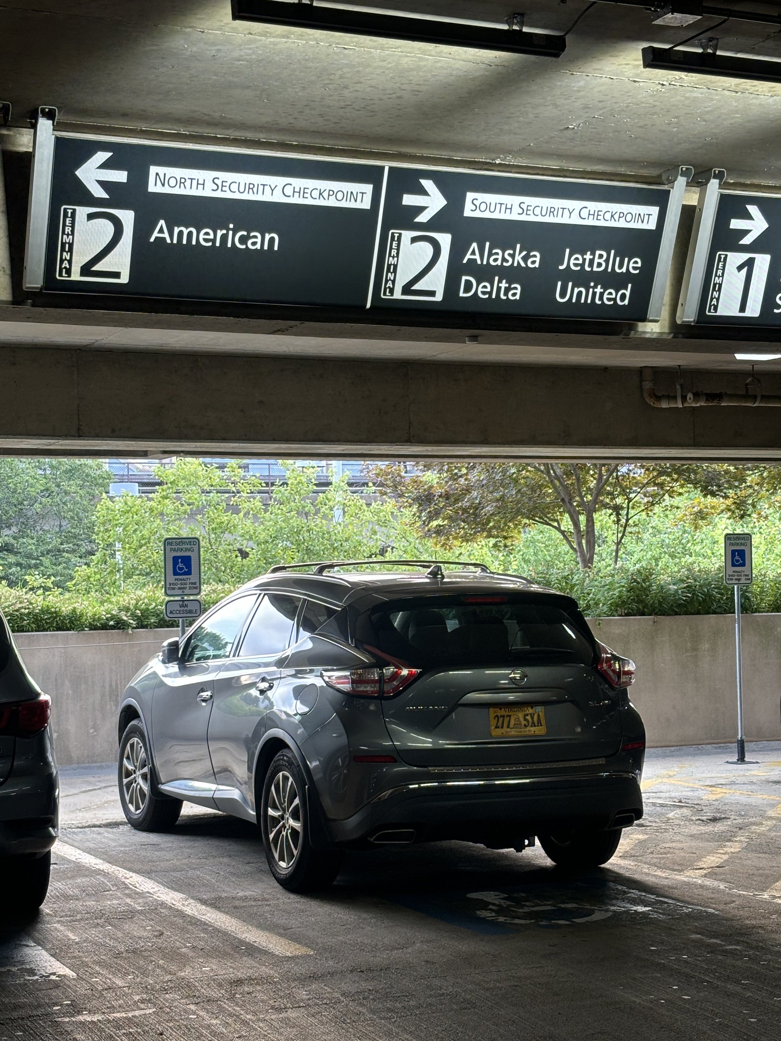 THIS SIGN SPLITS PEOPLE INTO TWO DIFFERENT DIRECTIONS. THERE IS NO NEED SINCE SECURITY IN THE BUILDING IS QUITE CLOSE TOGETHER ANYWAY. THIS CREATES SMALLER NUMBERS OF PEOPLE IN EACH GROUP AND POTENTIALLY DANGEROUS FOR VULNERABLE PEOPLE