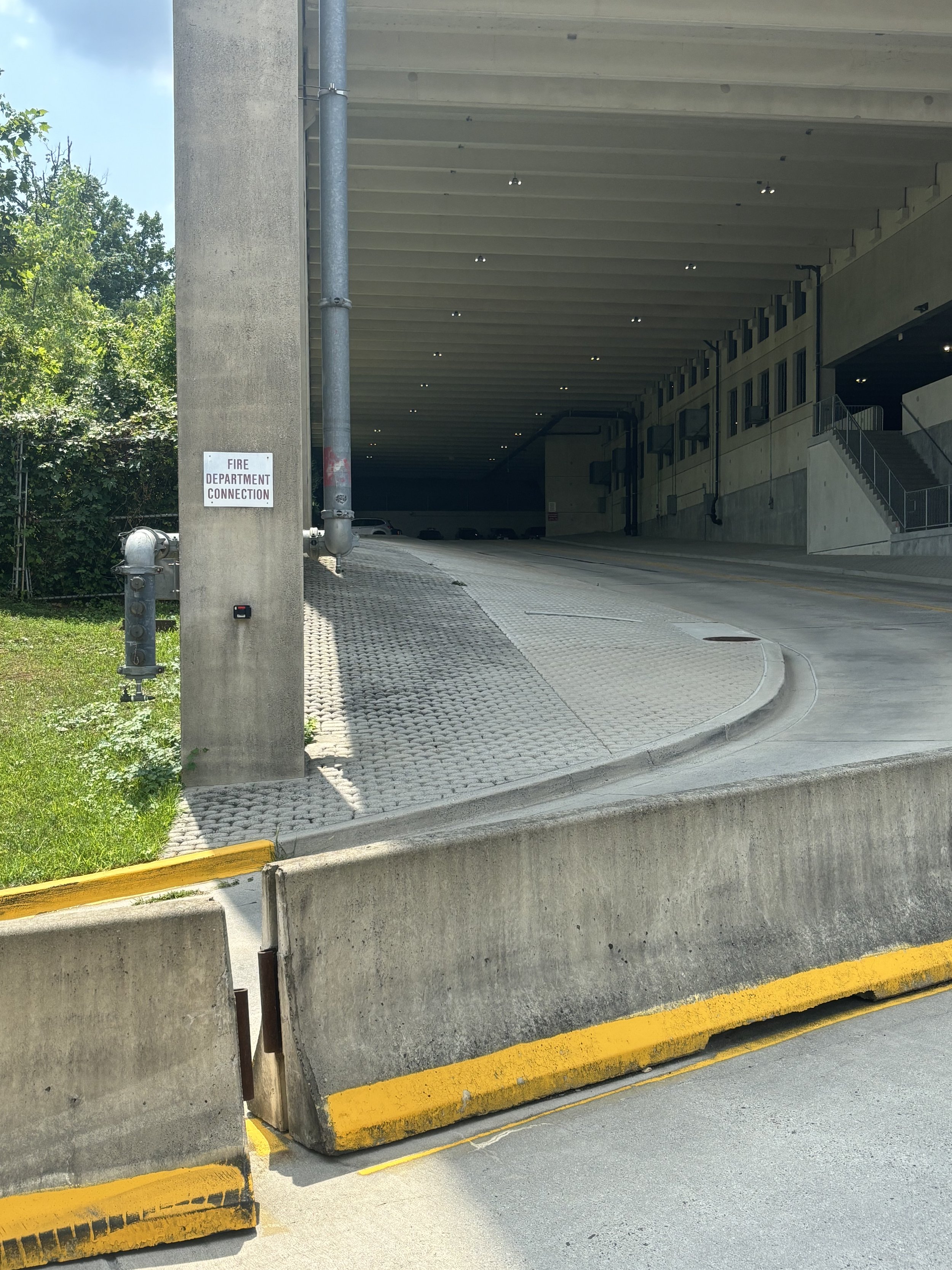 OUTSIDE THE NEW CAR PARK. A VERY OBVIOUS 'FIRE DEPARTMENT CONNECTION' SIGN. IT DOES SEEM THAT'S WHAT YOU NEED TO THINK (SO YOU MIGHT THEN ASSUME ALL OTHERS ARE FIRE DEPARTMENT?)
