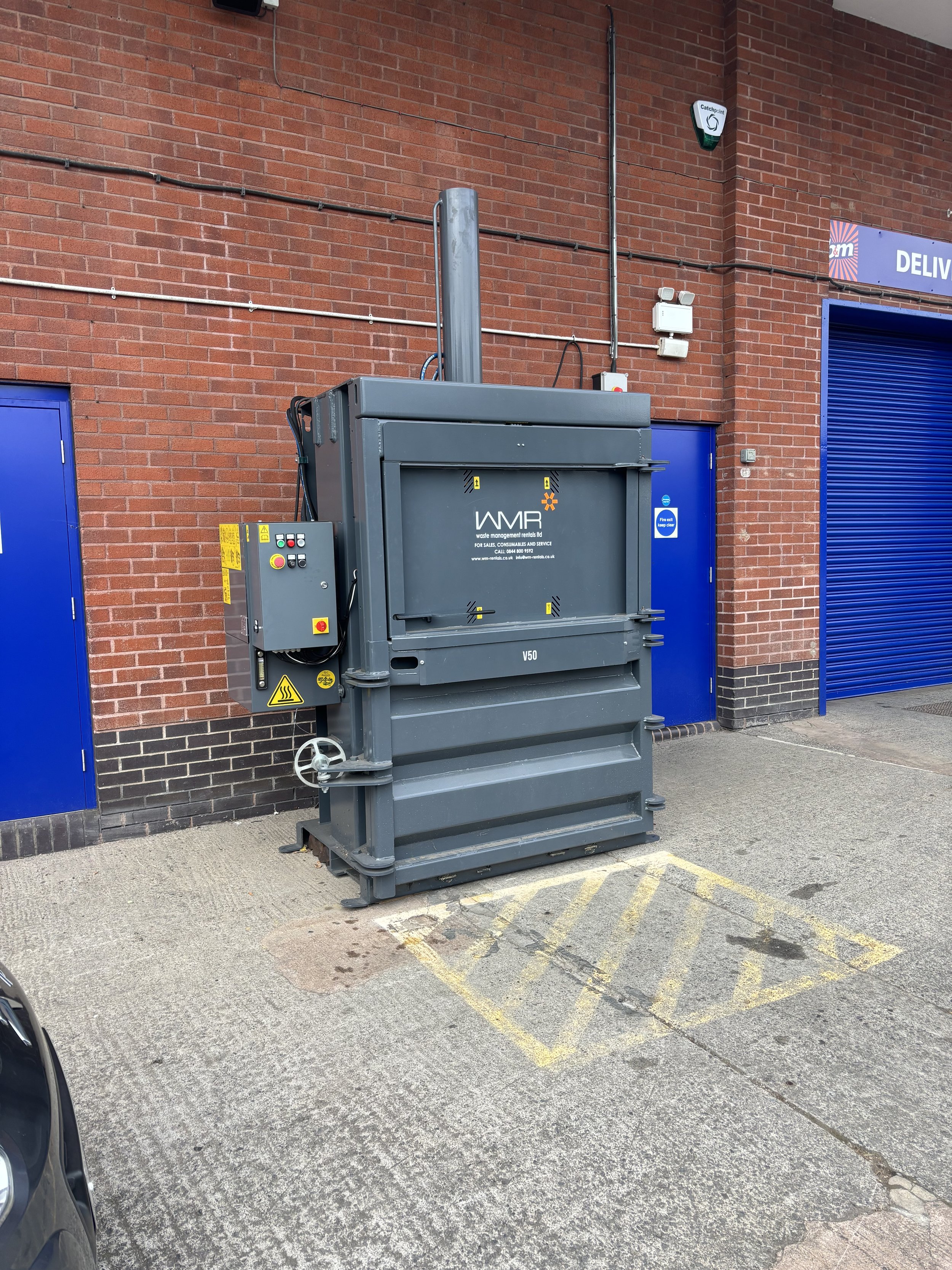 A 'RECYCLING' MACHINE WITH A LARGE CHIMEY. THIS LOOKS LIKE AN INCINERATOR AND IDEAL FOR BURNING ANY MATERIALS FROM A BODY WHICH DOESN'T LIFIFY (SUCH AS TEETH, PACEMAKERS ETC)