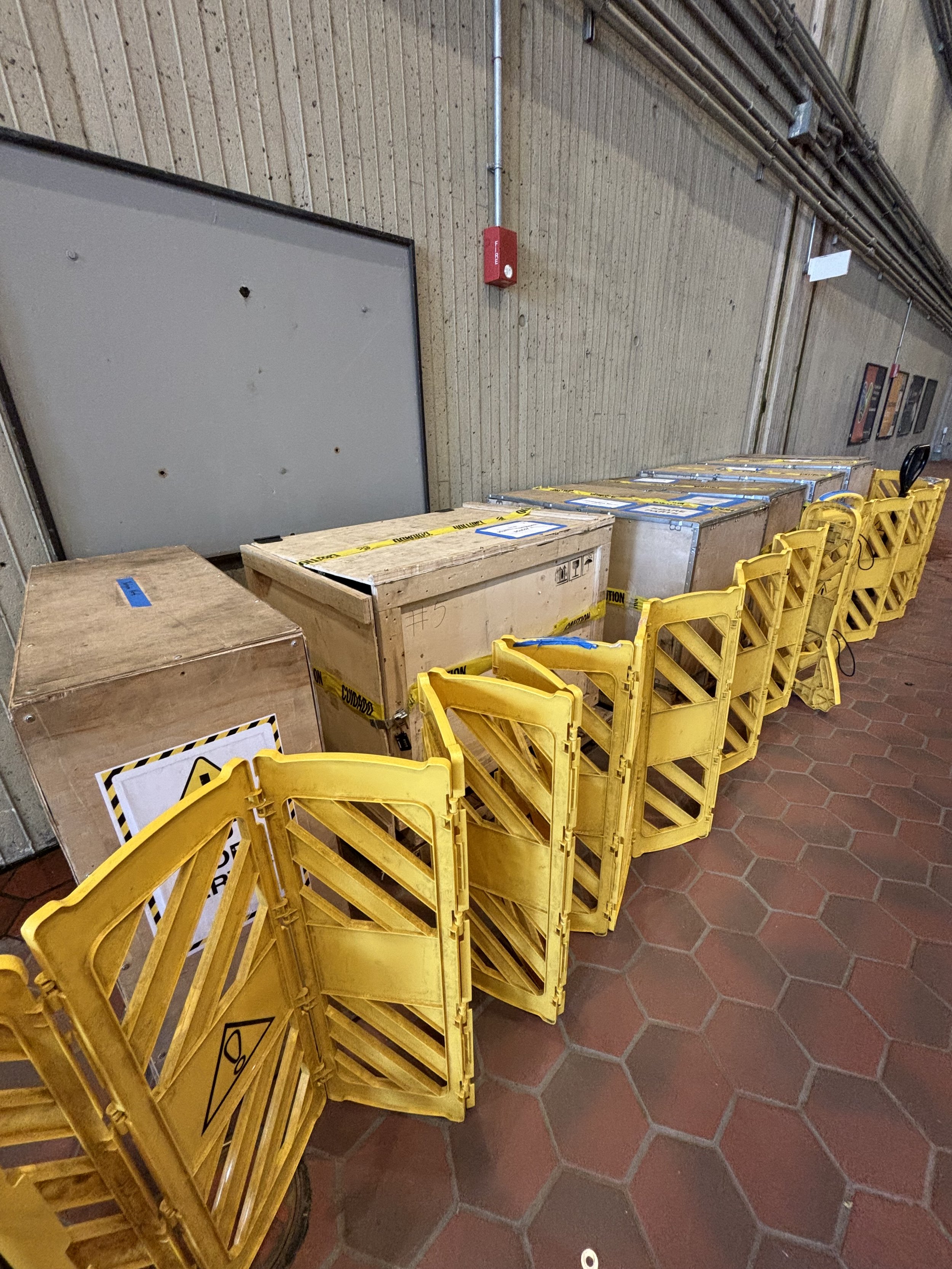 AN ARRAY OF DIFFERENT DELIVERIES (SPARE PARTS ETC ON THE LABELS) IN THE METRO MAIN ENTRANCE