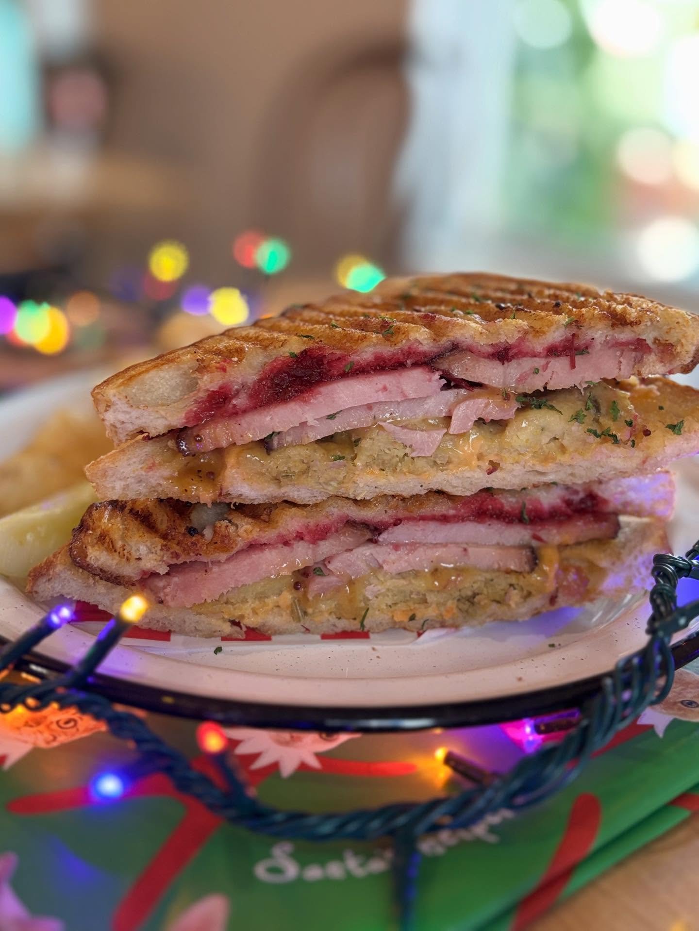 Our holiday ham sandwich is here&mdash;and it&rsquo;s magic!! Sweet, savory and stacked with all of your nostalgic flavors of the holidays on toasted sourdough. Spiral ham, cornbread stuffing, cranberry relish, sweet potato mayo and a praline crunch.