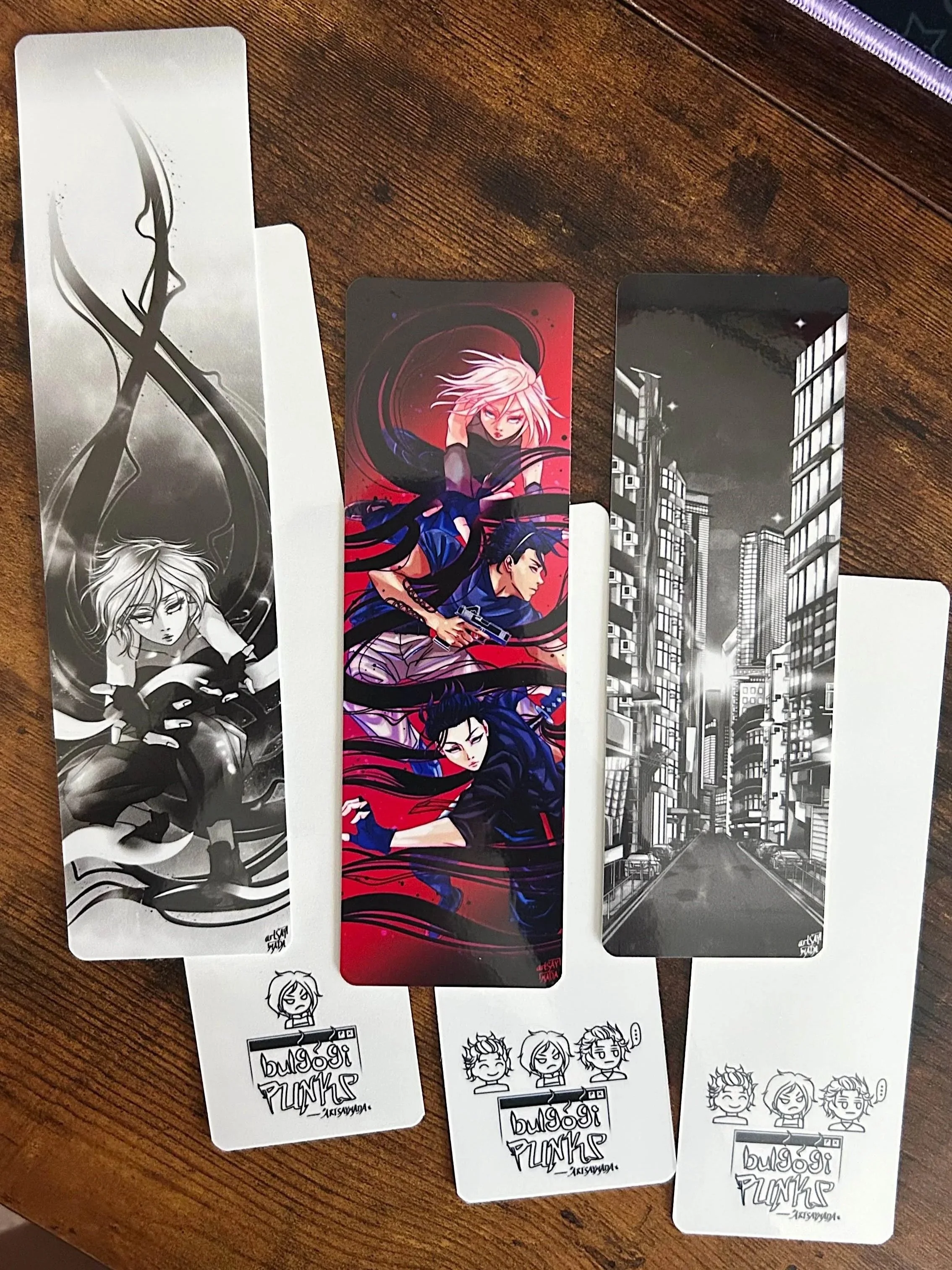 2" x 8" and 2" x 6" laminated bookmarks.
click photo to see my bookmark-making process!