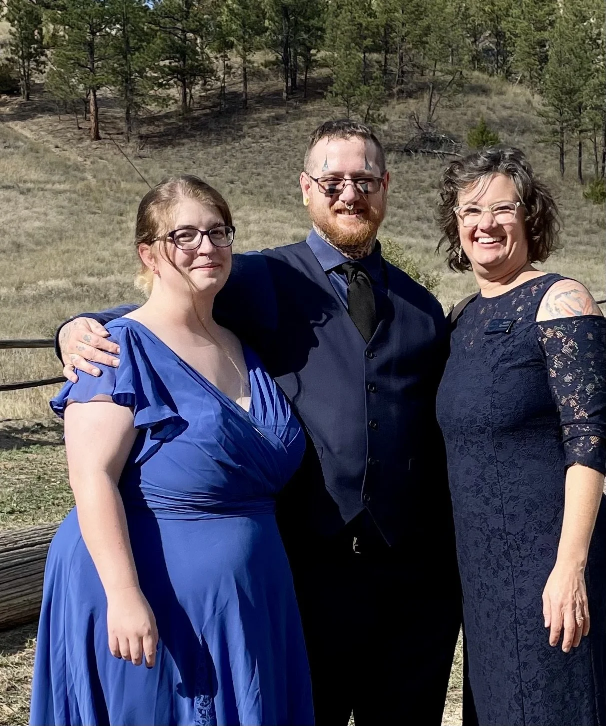 Wedding all in blue with piercings and tattoos on full display