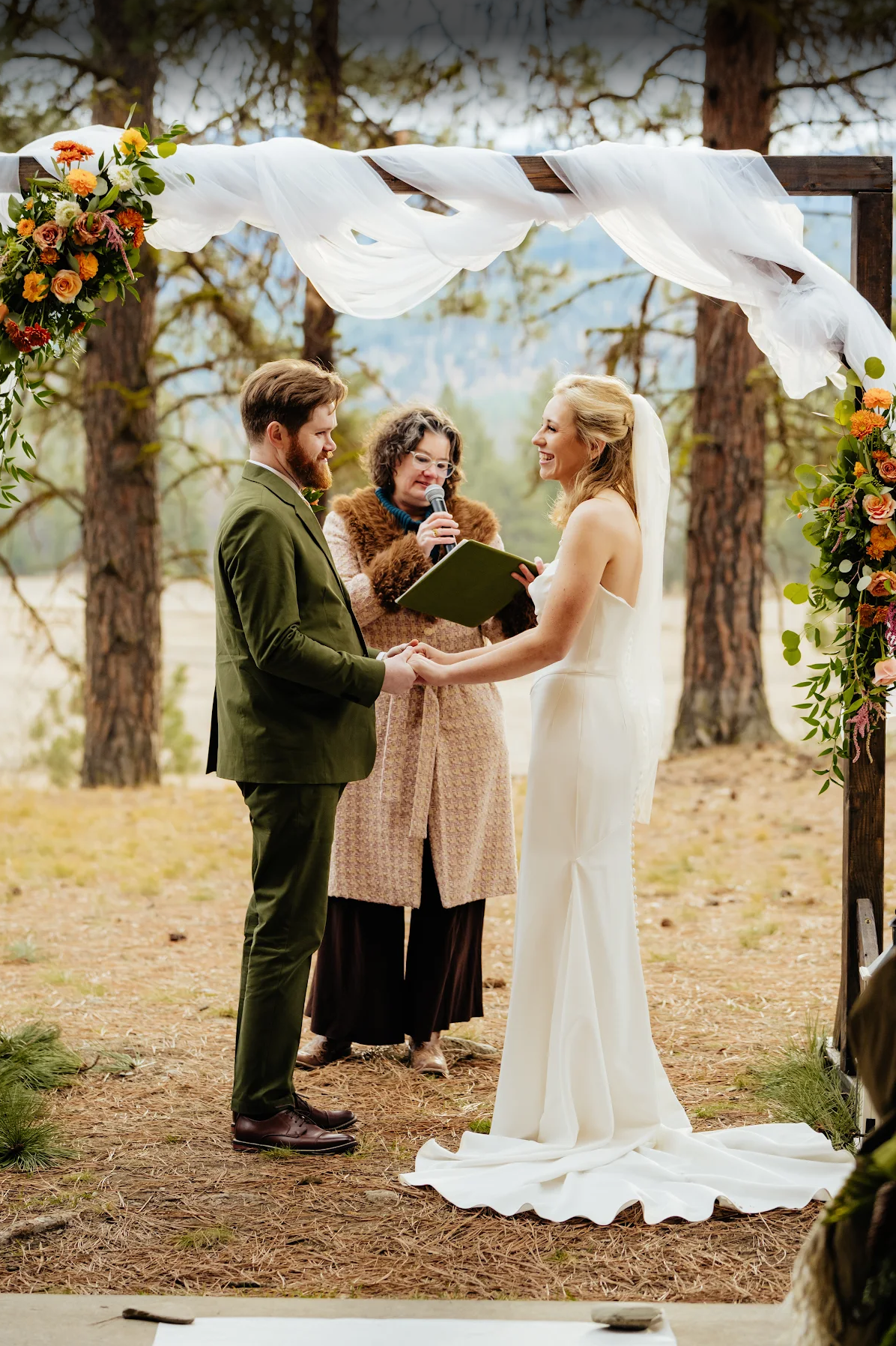 bride and groom in the colds woods