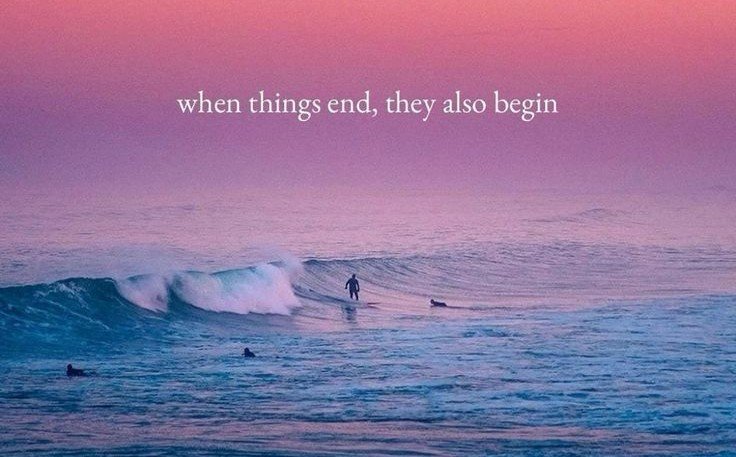 A person surfing on a wave in the ocean at sunset with a pink and purple sky, and the quote "when things end, they also begin" overlaid at the top.