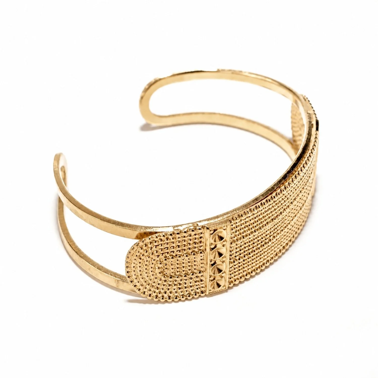 A closer look at the Bellanda " cuff bracelet ," featuring details of the pattern and gold finish
