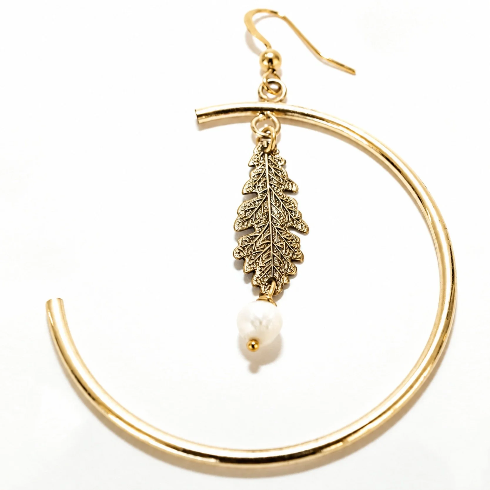 Close-up of the oak leaf hoop earrings with pearls, showing the design and gold finish in detail