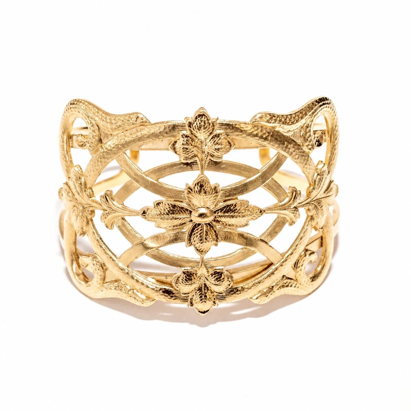 A closer look at the " cuff bracelet " by Aurore, featuring details of the pattern and gold finish