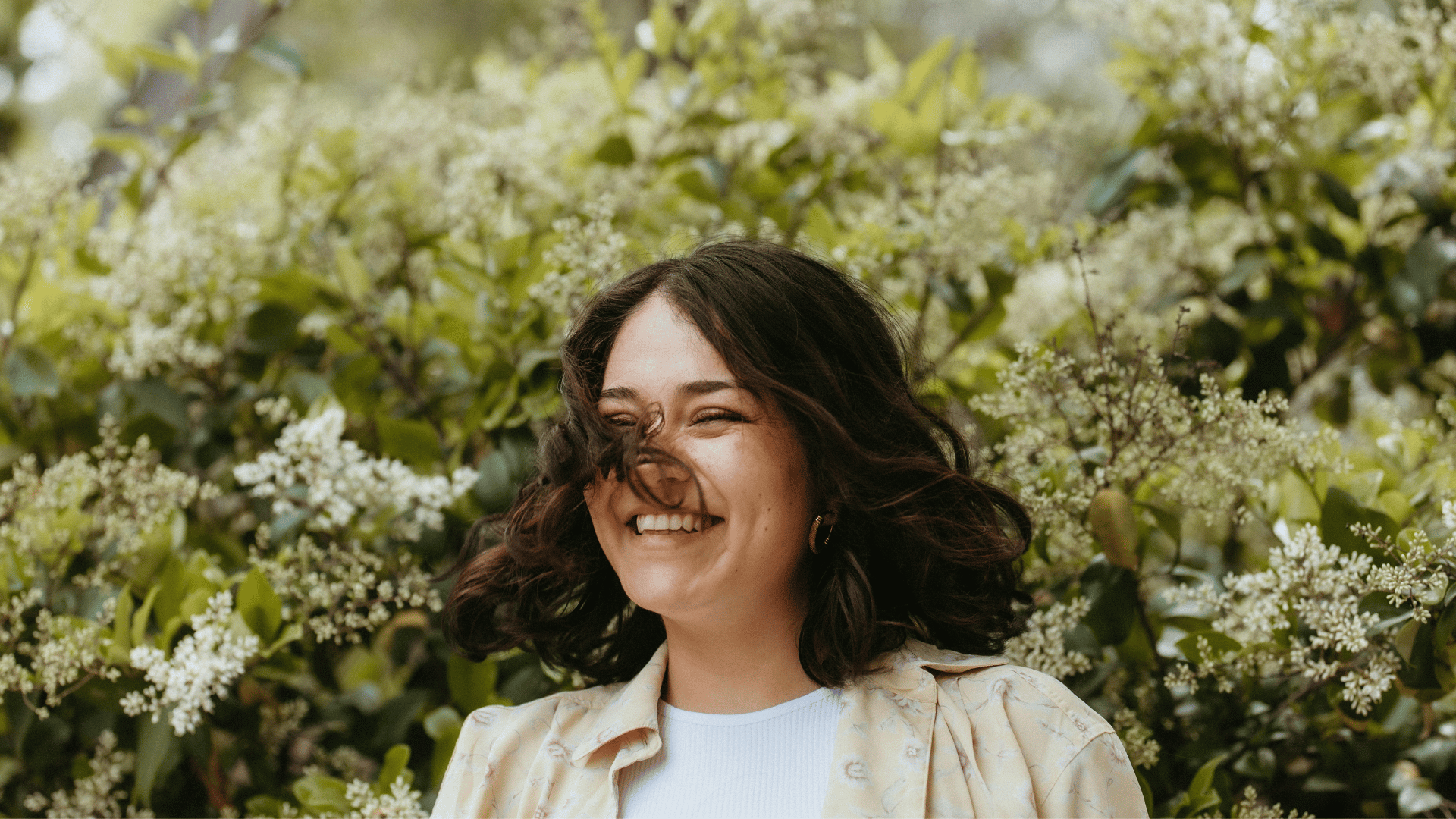 A young woman smiling and happy in nature