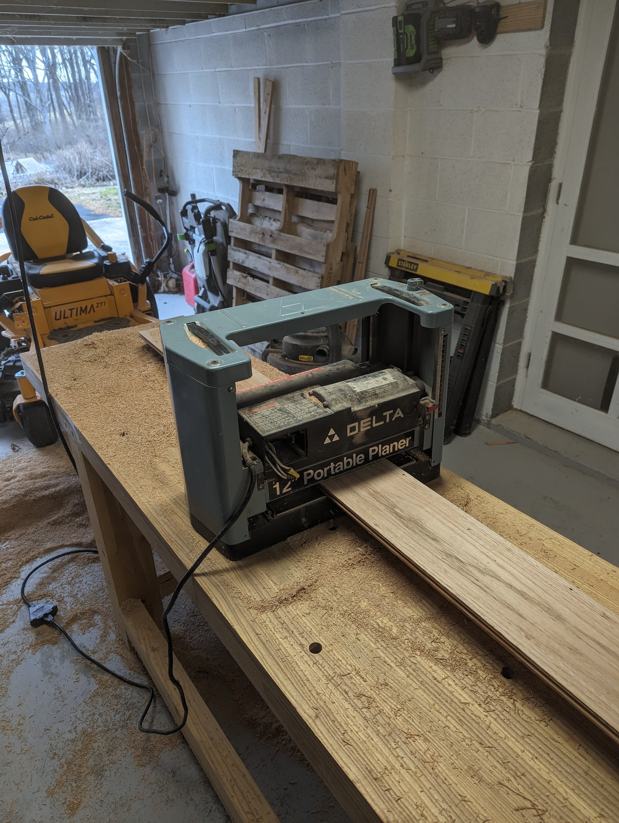  Once all of the boards were put through the jointer and had a flat surface, they were then put through the planer. This process removed the grooves from the bottoms of the boards and made sure that each board was the same thickness. 