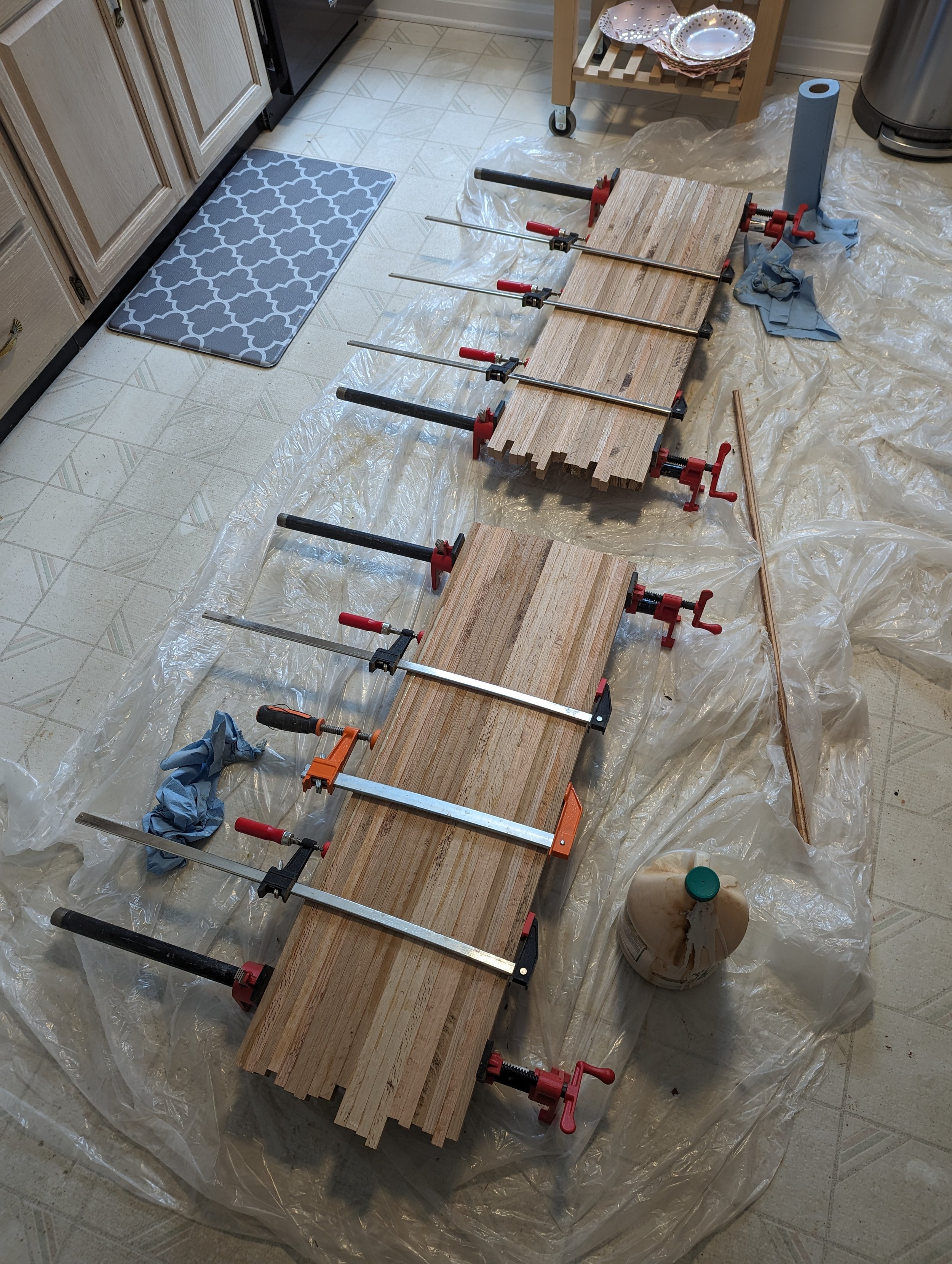  Here are the two tops in the process of drying. Note that many clamps were used to ensure that there was consistent pressure across the glue-ups (some might say I should have used more clamps, but this worked well for me).  