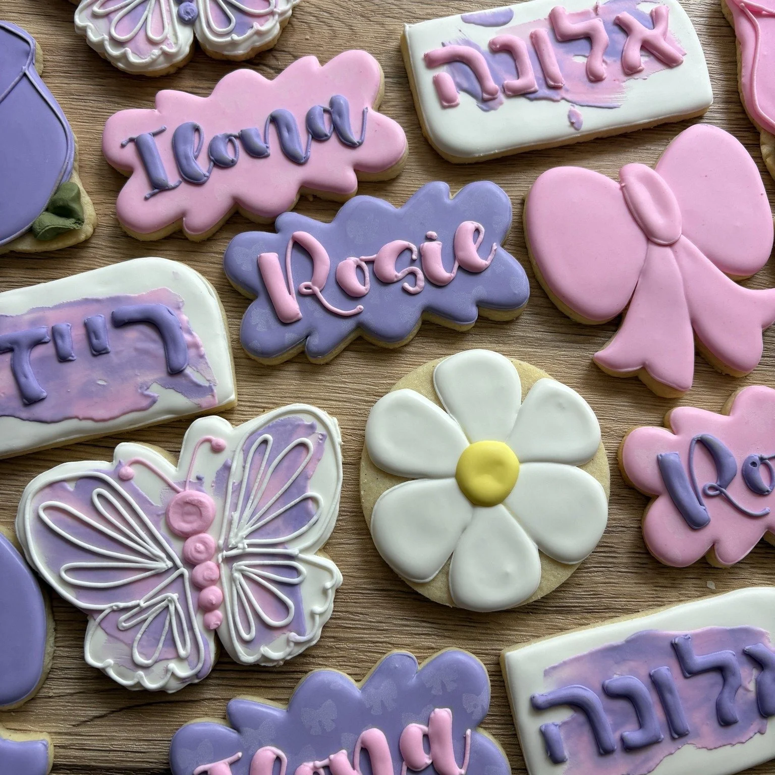 🦋🌸 Double the blessing, double the sweetness! 💕 We had the joy of creating these pink and purple butterfly and flower sugar cookies for a very special Hebrew baby naming &mdash; celebrating two beautiful cousins together. ✨

Soft colors, delicate 