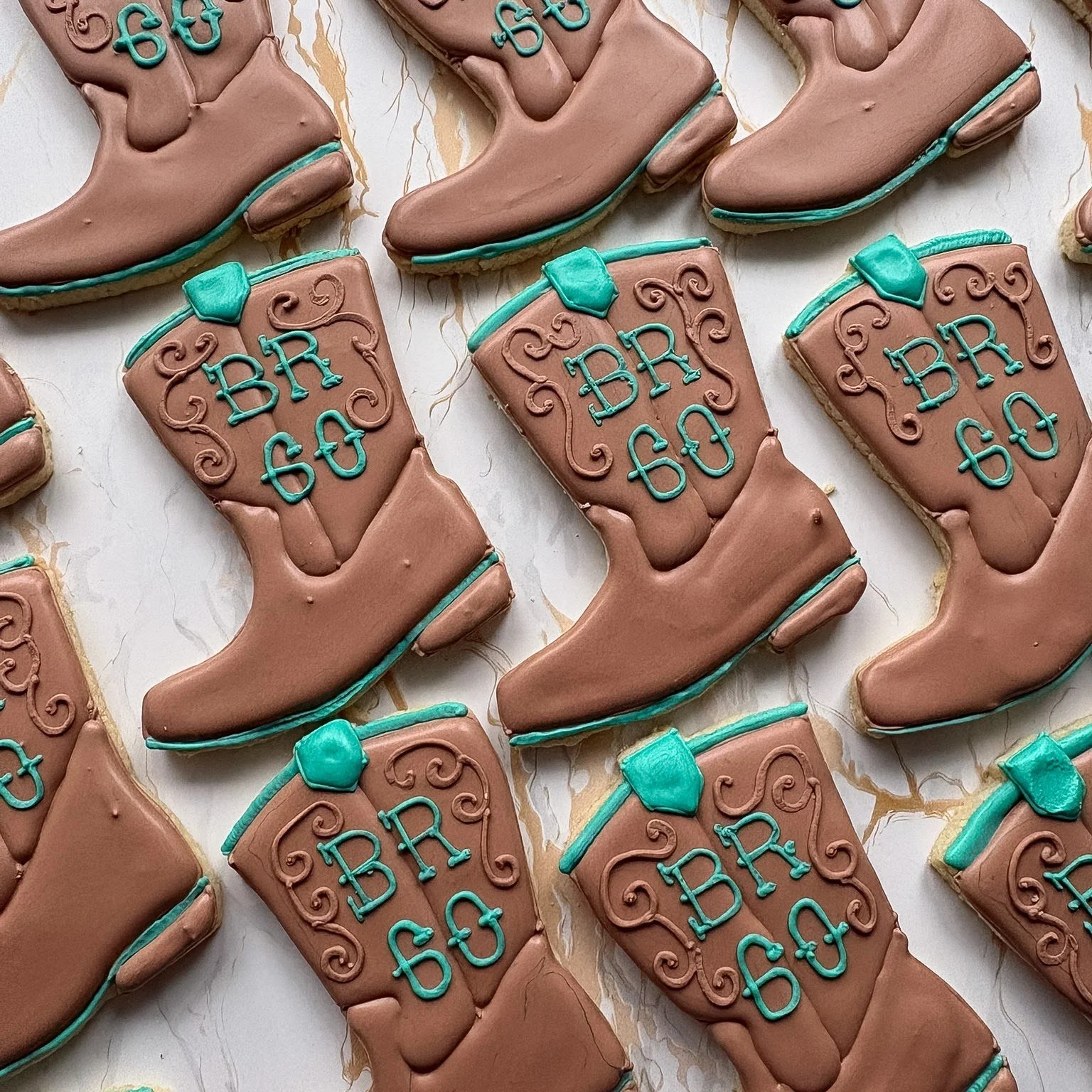 These boots were made for celebrating! 🤠✨

Custom western boot cookies for a special birthday&mdash;complete with scroll details and a personalized &ldquo;BR 60.&rdquo; There&rsquo;s nothing we love more than turning a theme into something sweet and