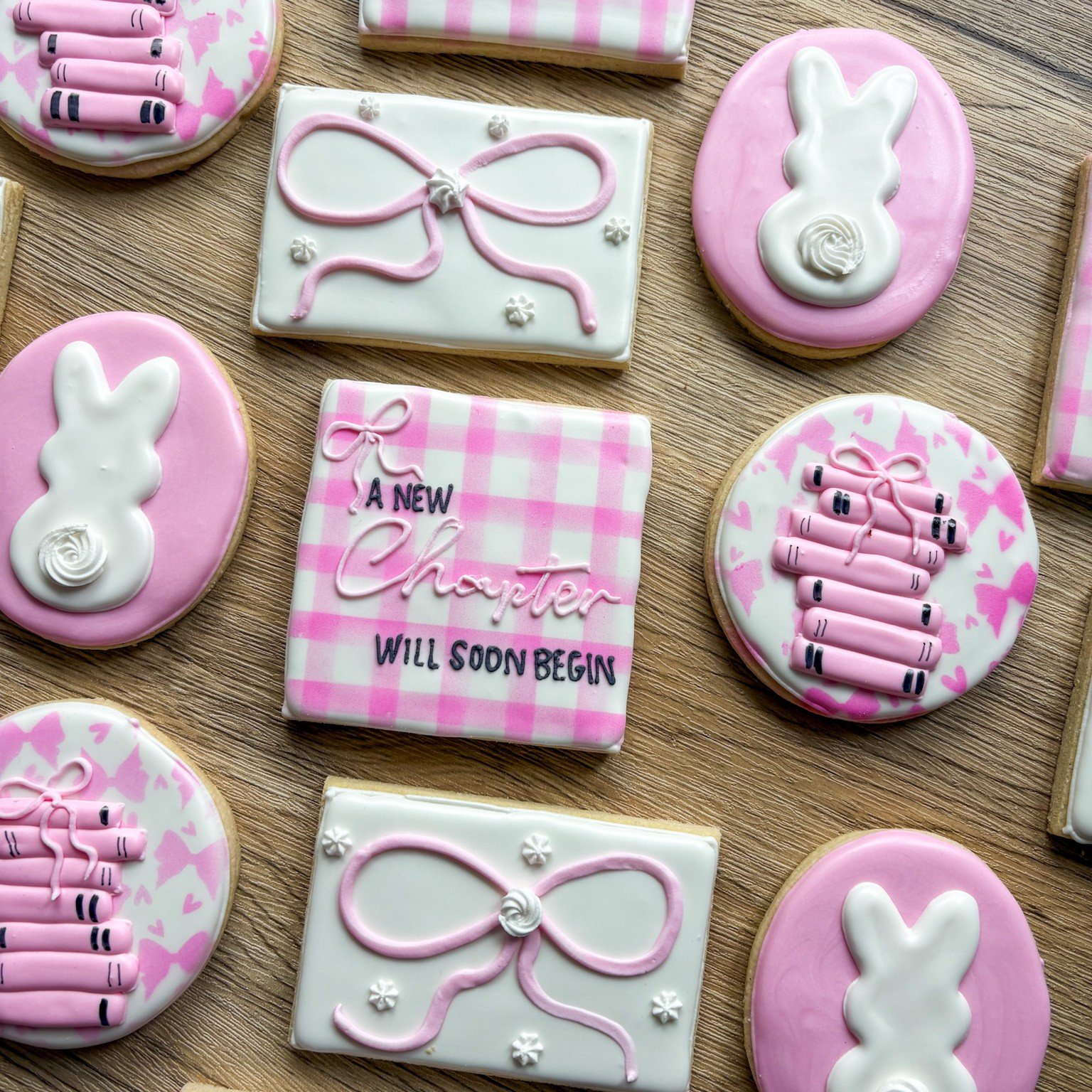 A sweet new chapter is about to begin. 💕📖

These soft pink baby shower cookies were designed to celebrate a little one on the way&mdash;complete with gingham details, bows, bunny tails, and the sweetest message: &ldquo;A New Chapter Will Soon Begin