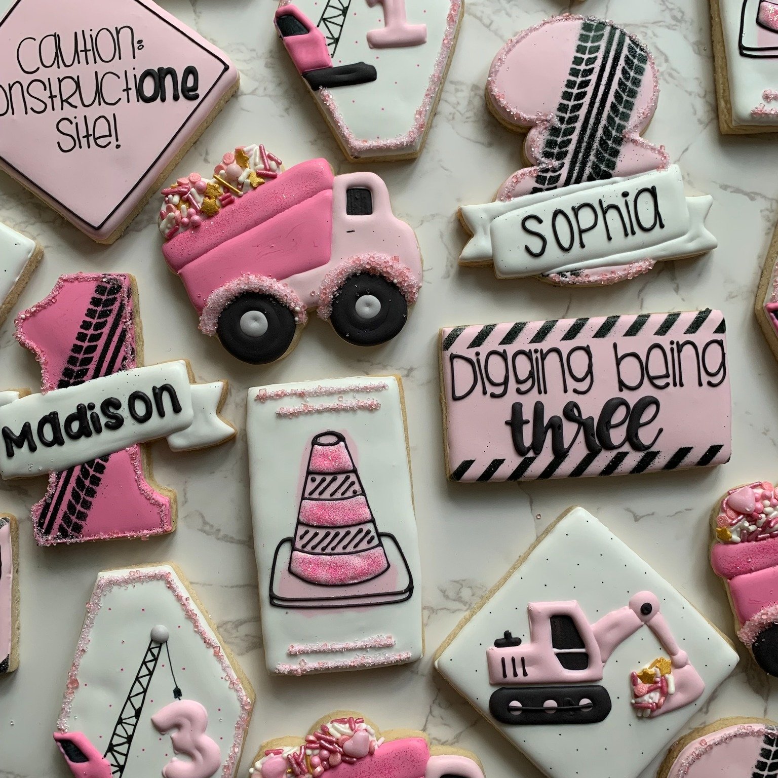 Sugar, sparkle, and a little bit of construction! 🚧💖

These girly construction cookies prove that hard hats and bulldozers can be cute too. Perfect for a birthday girl who loves all things pink and building big things!

From dump trucks to tools wi