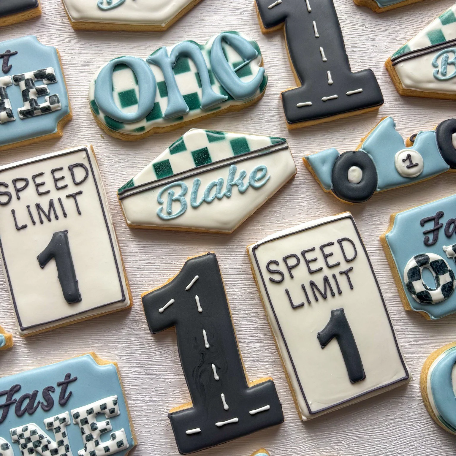 🏁💙 Fast ONE is speeding in! 💙🏁

Celebrate your little racer turning ONE with the cutest race car&ndash;themed cookies! From &ldquo;Speed Limit 1&rdquo; signs to personalized name cookies and mini cars, this set is perfect for a high-speed first b