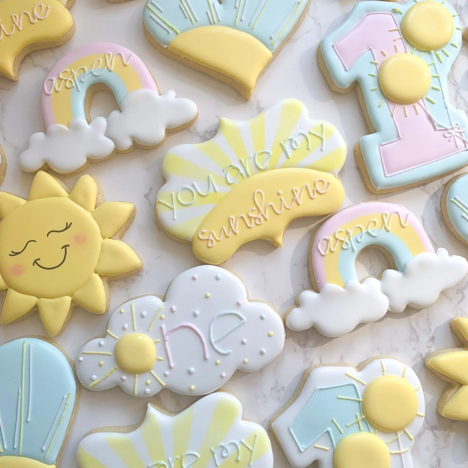 ☀️✨ You Are My Sunshine ✨☀️

A little ray of sunshine is turning ONE! 🌼🍪 This &ldquo;You Are My Sunshine&rdquo; themed first birthday cookie set is made to brighten the sweetest milestone.

Featuring soft yellow tones, happy sun designs, florals, a