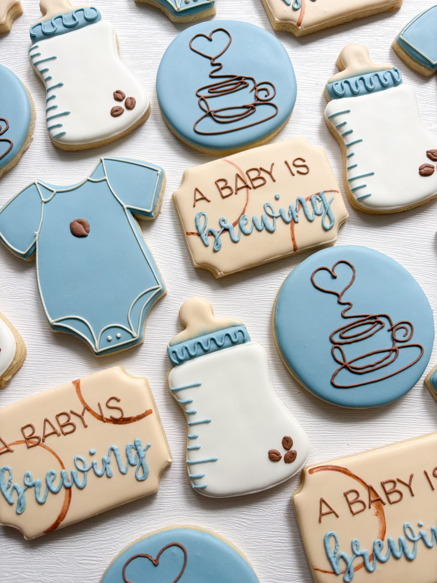☕🤎 A baby is brewing! 🤎☕

What's better than coffee and cookies? Celebrating a little one on the way with both! These "A Baby Is Brewing" themed cookies are the perfect blend of cozy and cute, featuring coffee cups, coffee beans, sweet sa