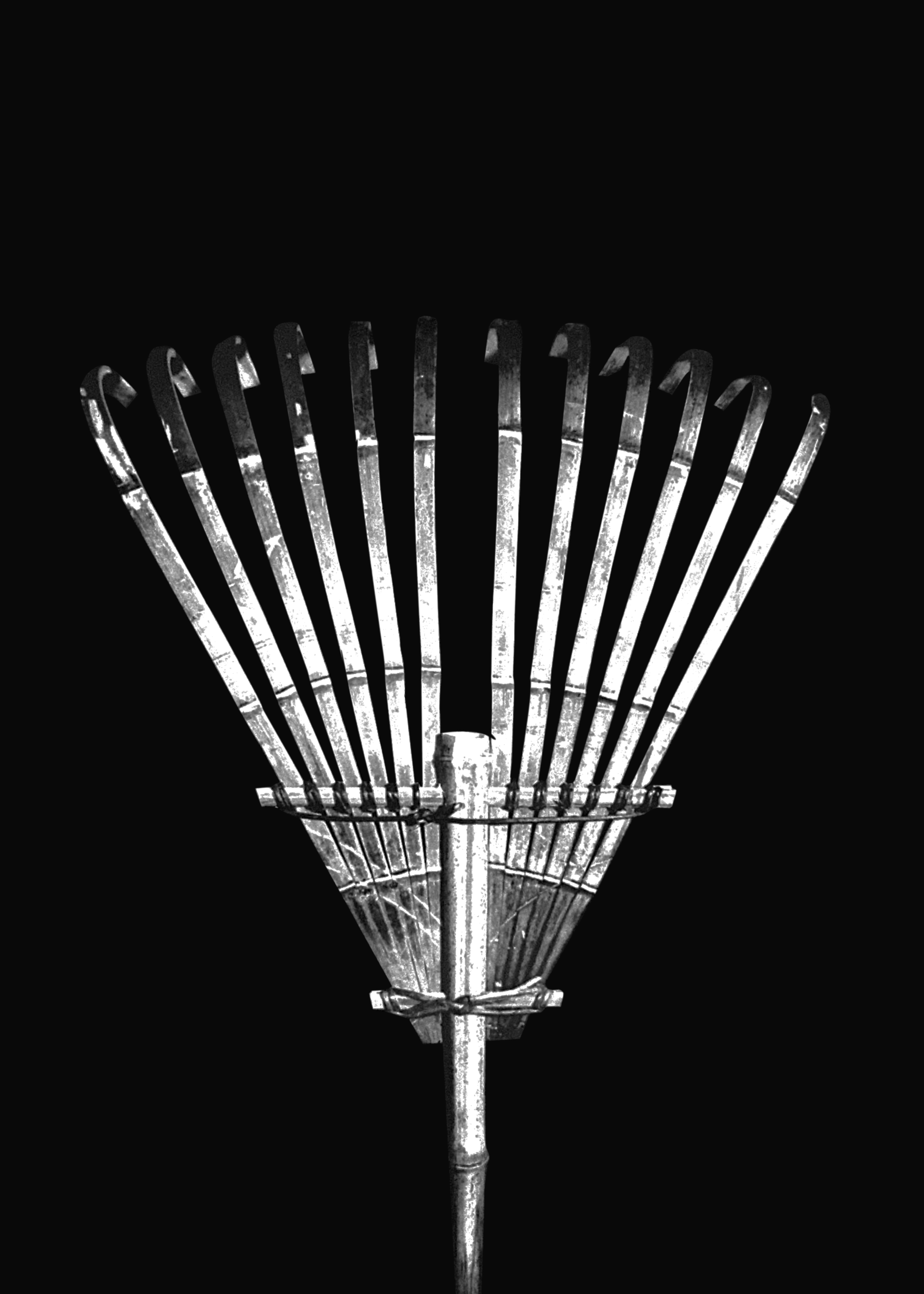 air. A rake, held by an aged man in the Noh-2.png