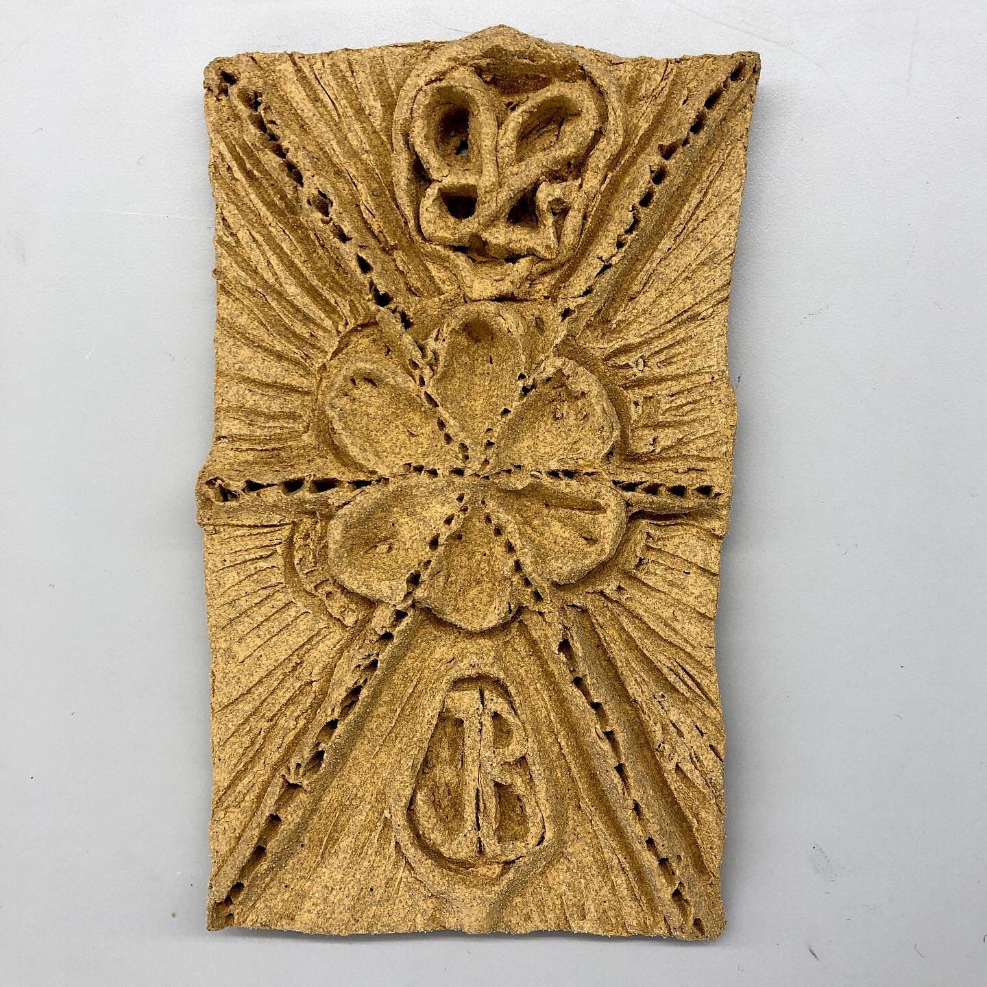 JB insignia Terracotta tile &bull; fired in the kiln at 10 cones &bull; 108&deg; F/h, 2345&deg; total for 2 days. 

Slide 1 is the final product post firing&bull;
Slide 2 is the air dried product before firing&bull;
Slide 3 is the original wet clay f
