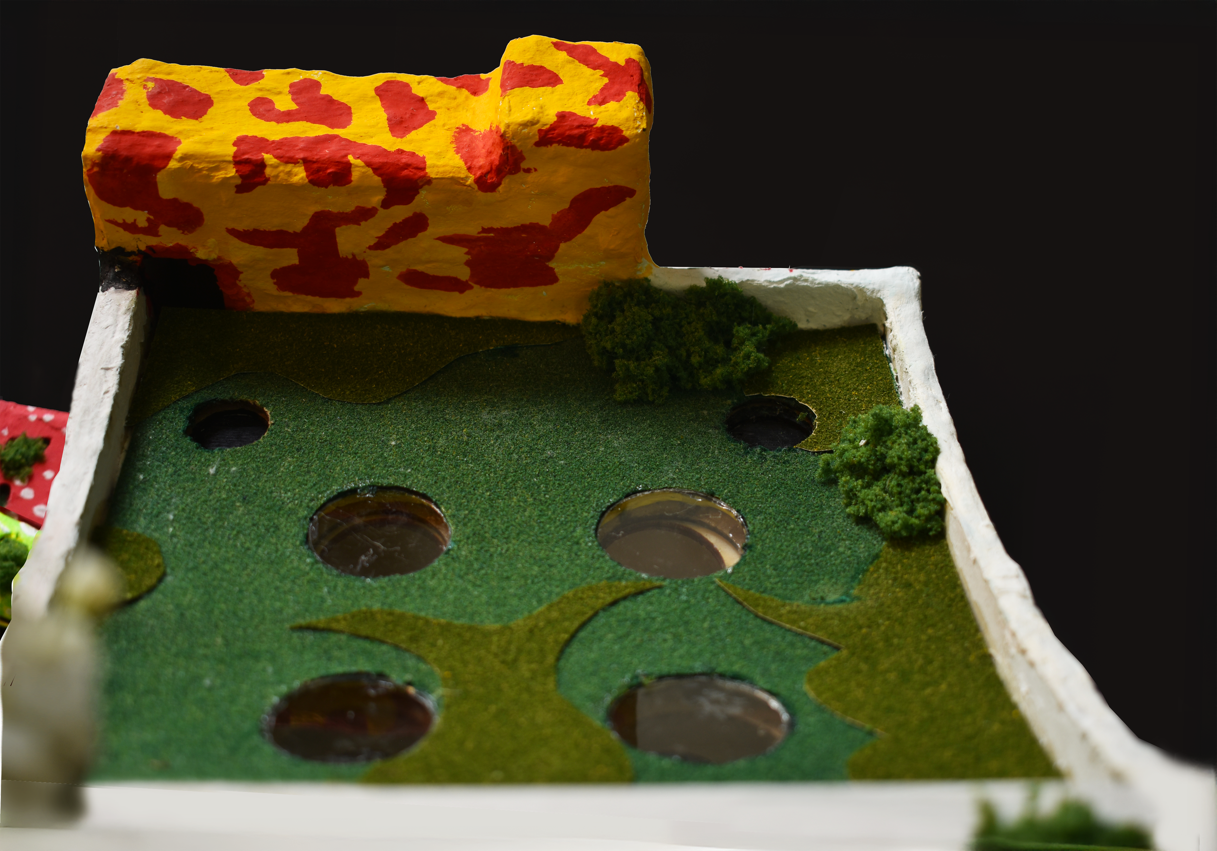 Sloped green roof with punched aperatures