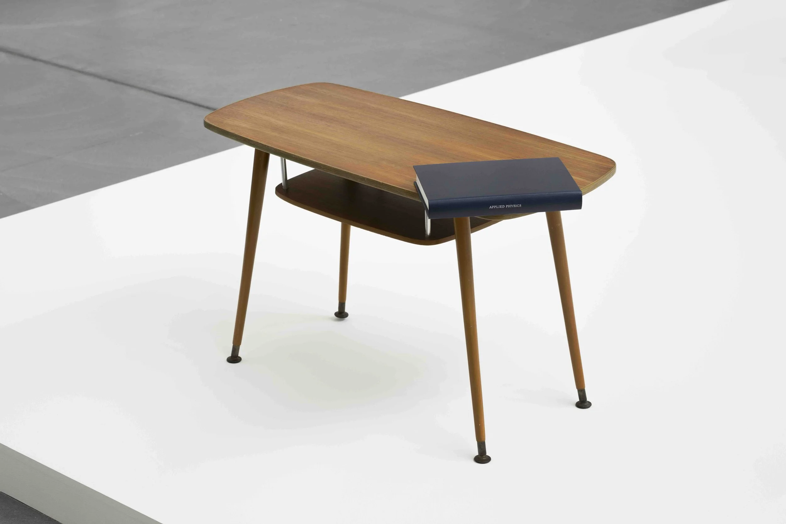 APPLIED PHYSICS (2025) - table with one shortened leg, balanced by  book