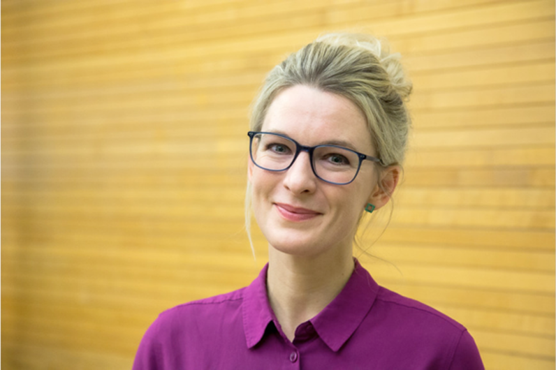 Headshot of Professor Amy Moran-Thomas, smiling