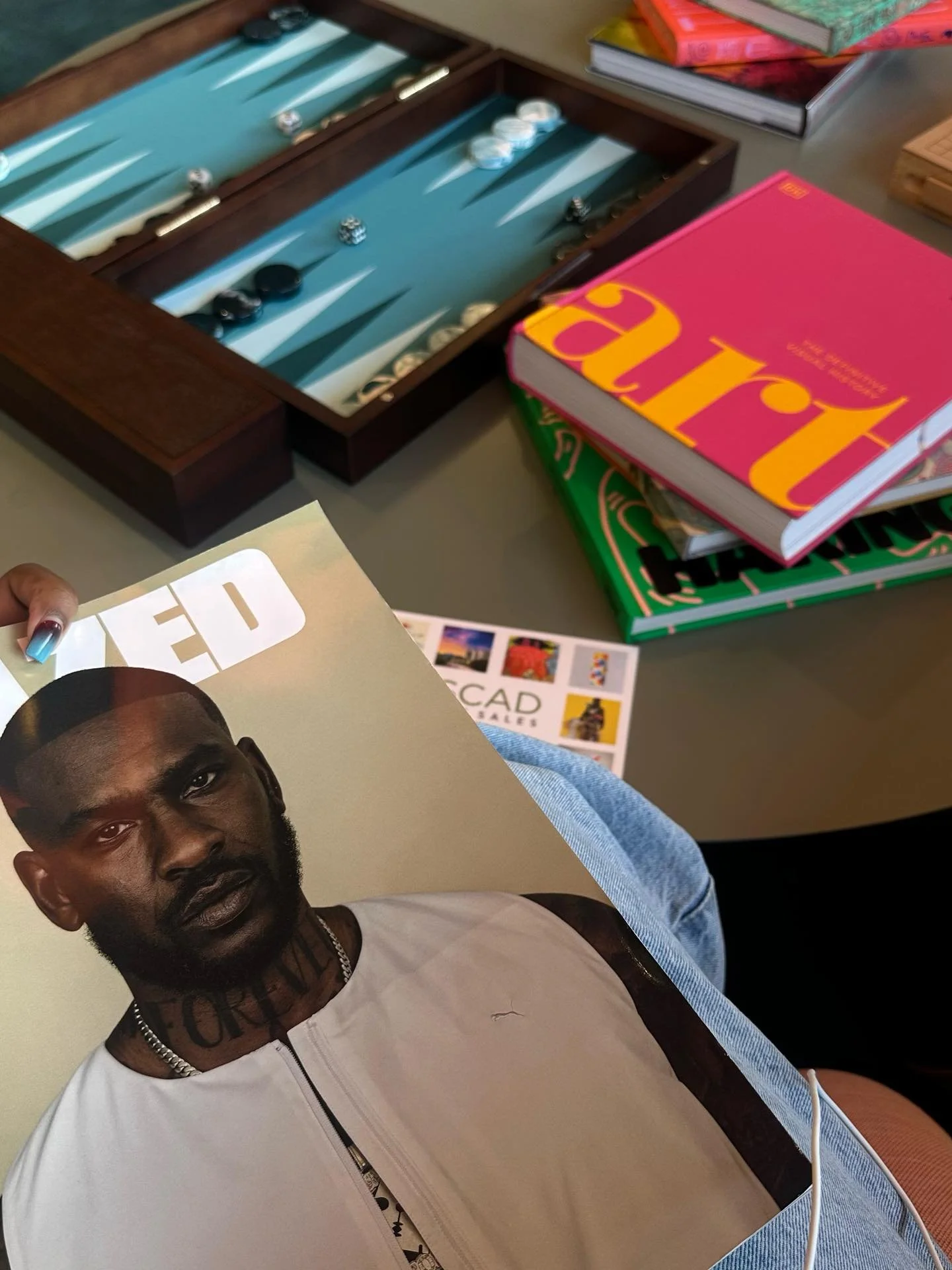 Books &amp; zines in my hand. One of my favorite things I like to collect and want to start collecting physical items. Very inspirational for creating concept and shaping stories. 💕