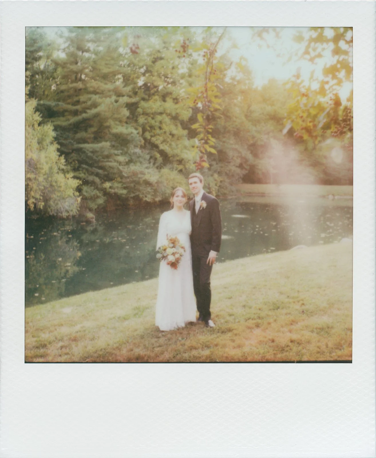 polaroid wedding portrait by the lake at avon gardens