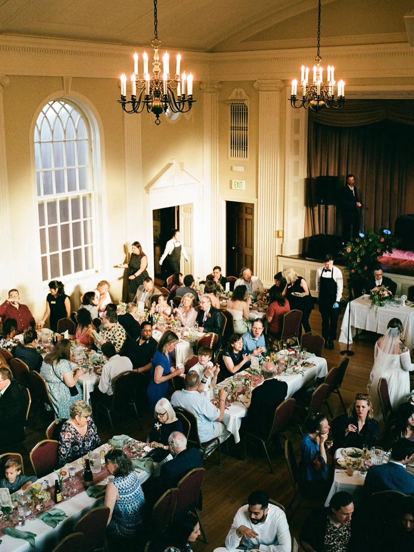 Thomas Duncan Hall from the balcony on film during Kirsten and Alex&rsquo;s reception this past spring. Those windows 🥲
