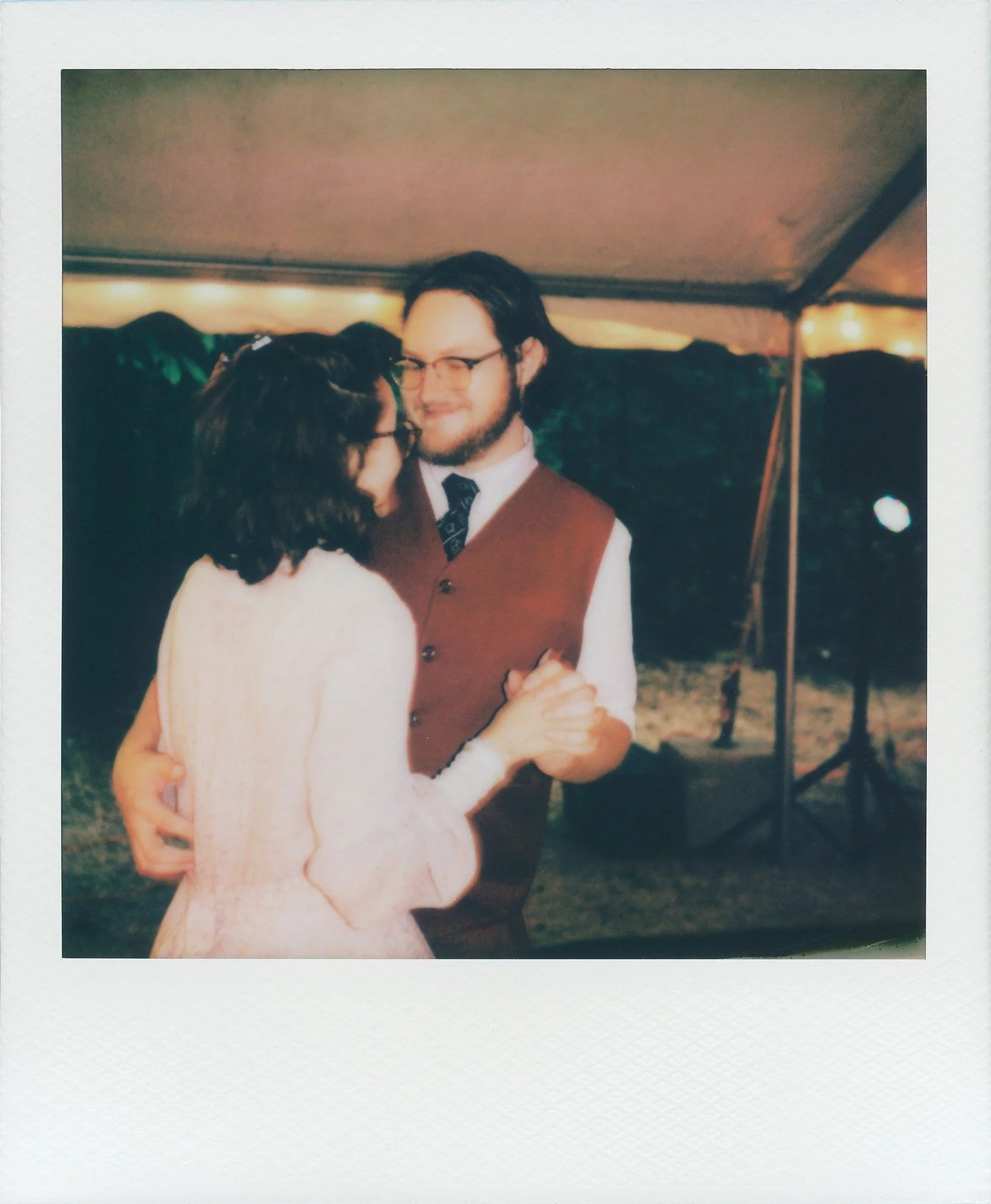 First dance Polaroids under a tent in Yellowwood.

#weddingsonfilm #poalroidwedding #stateparkwedding