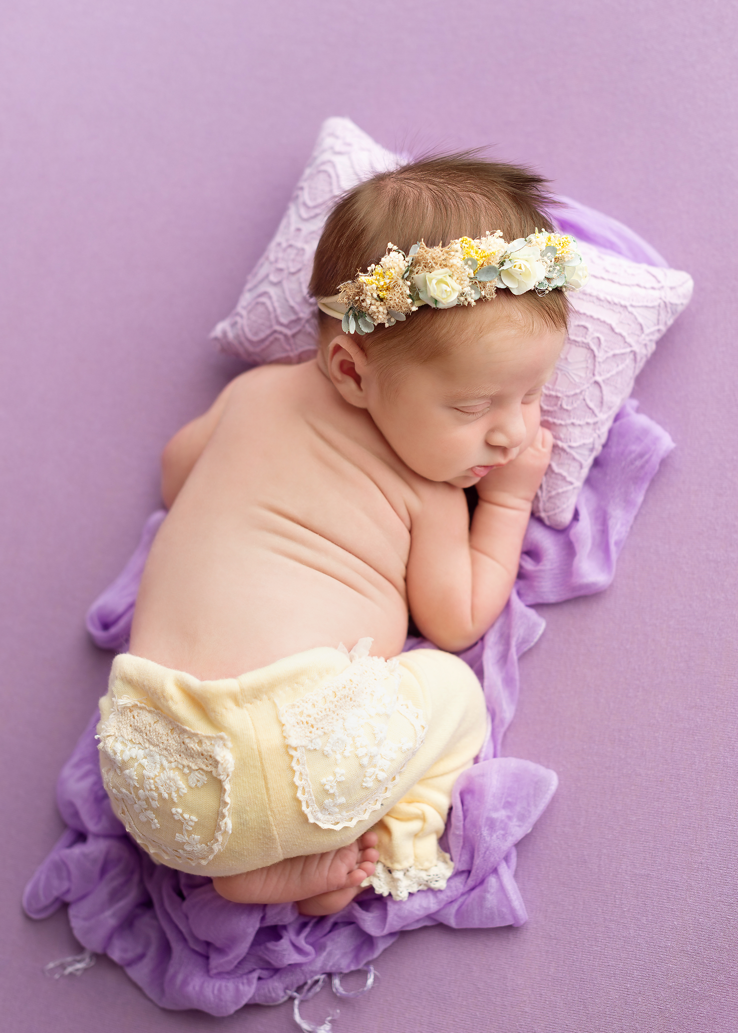 baby-girl-purple-blanket-yellow-pants-floral-headband-Kingston-newborn-photographer.png