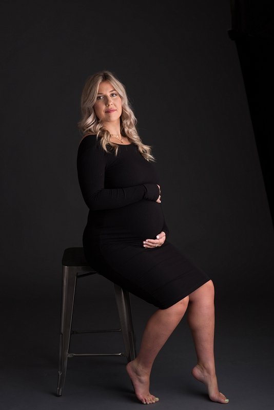 pregnant mother in black dress