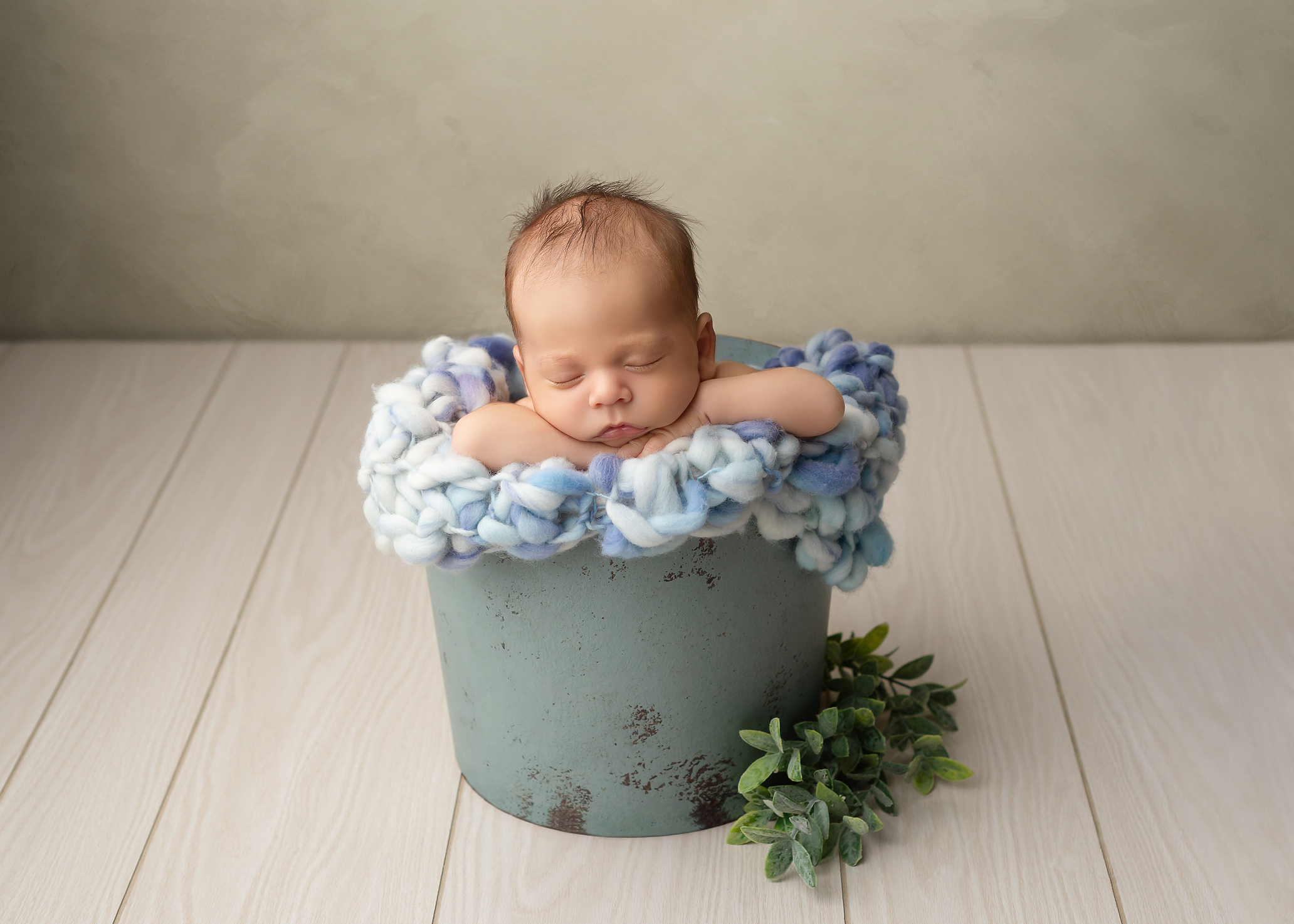 baby boy in bucket in Kingston portrait studio