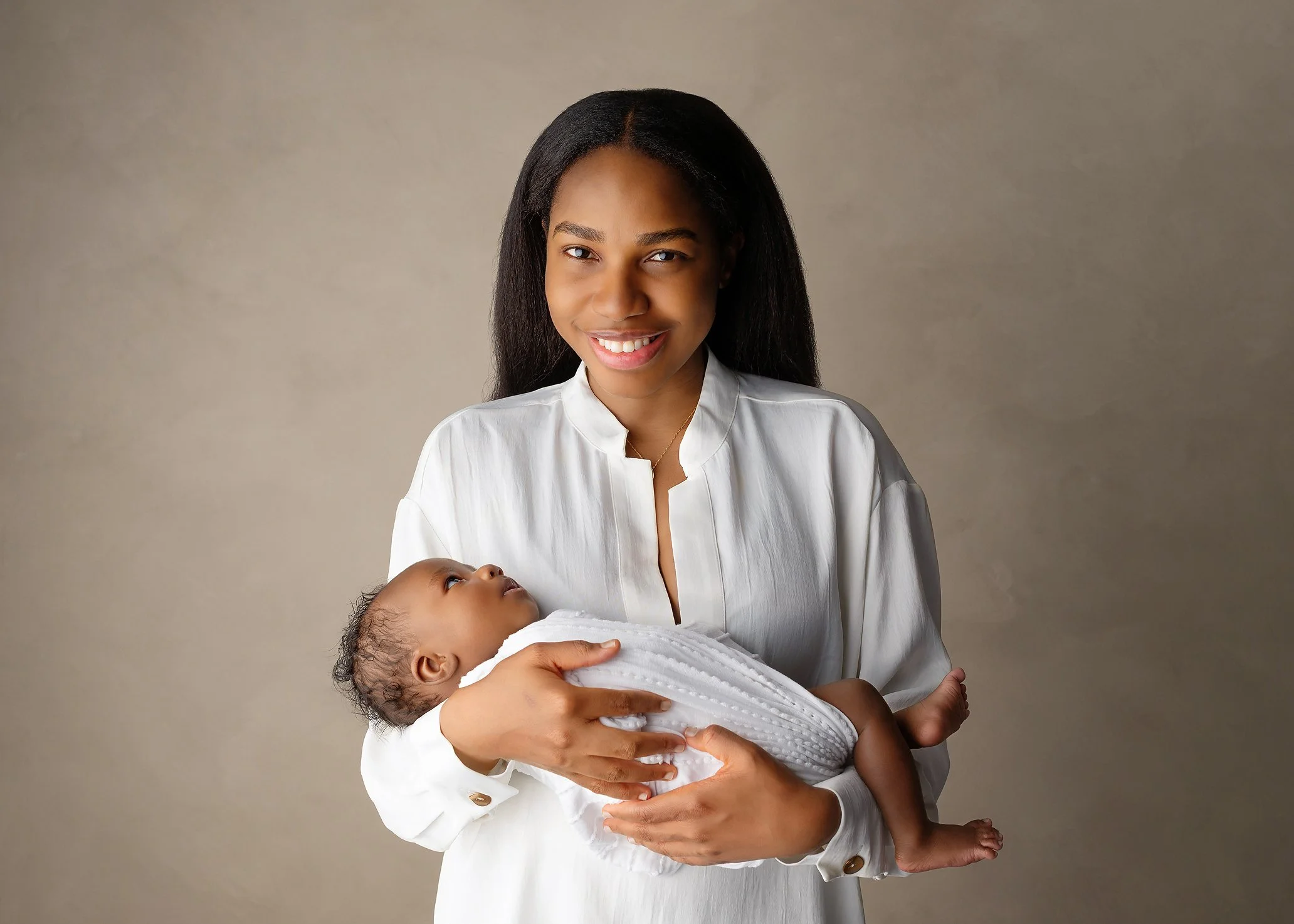 Mother-holding-son-swaddled-white-wrap-blouse-Kingston-newborn-photos.jpg