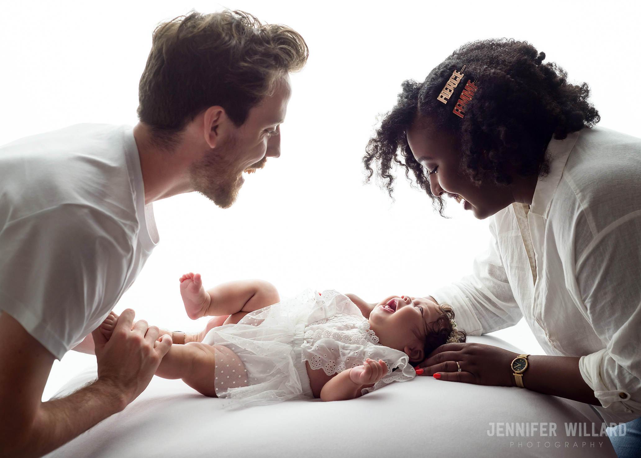 baby-girl-mother-father-family-backlit-smiling-Kingston-lifestyle-family-photographer.png