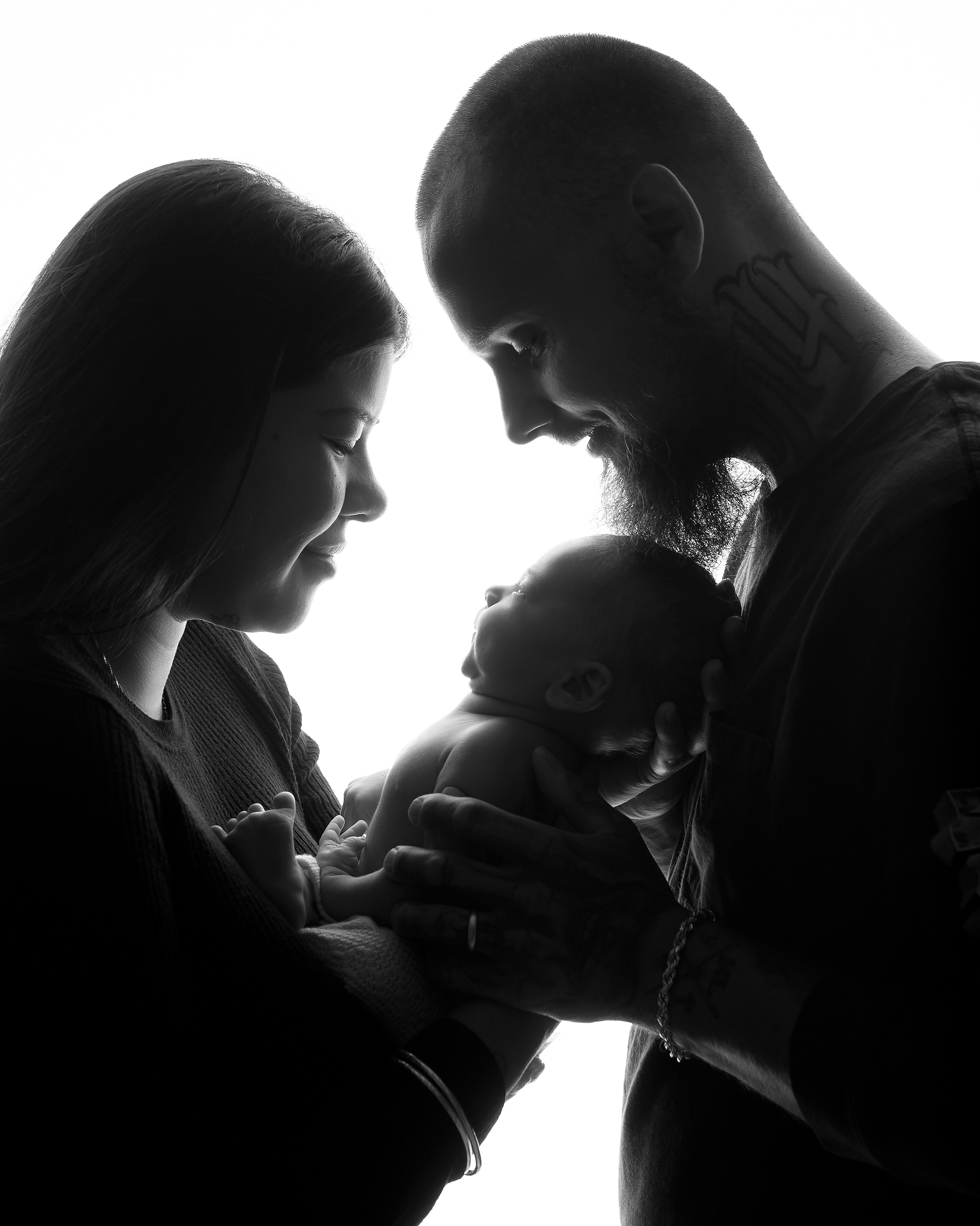 baby boy held in parent's hands in black and white in Kingston family photographer